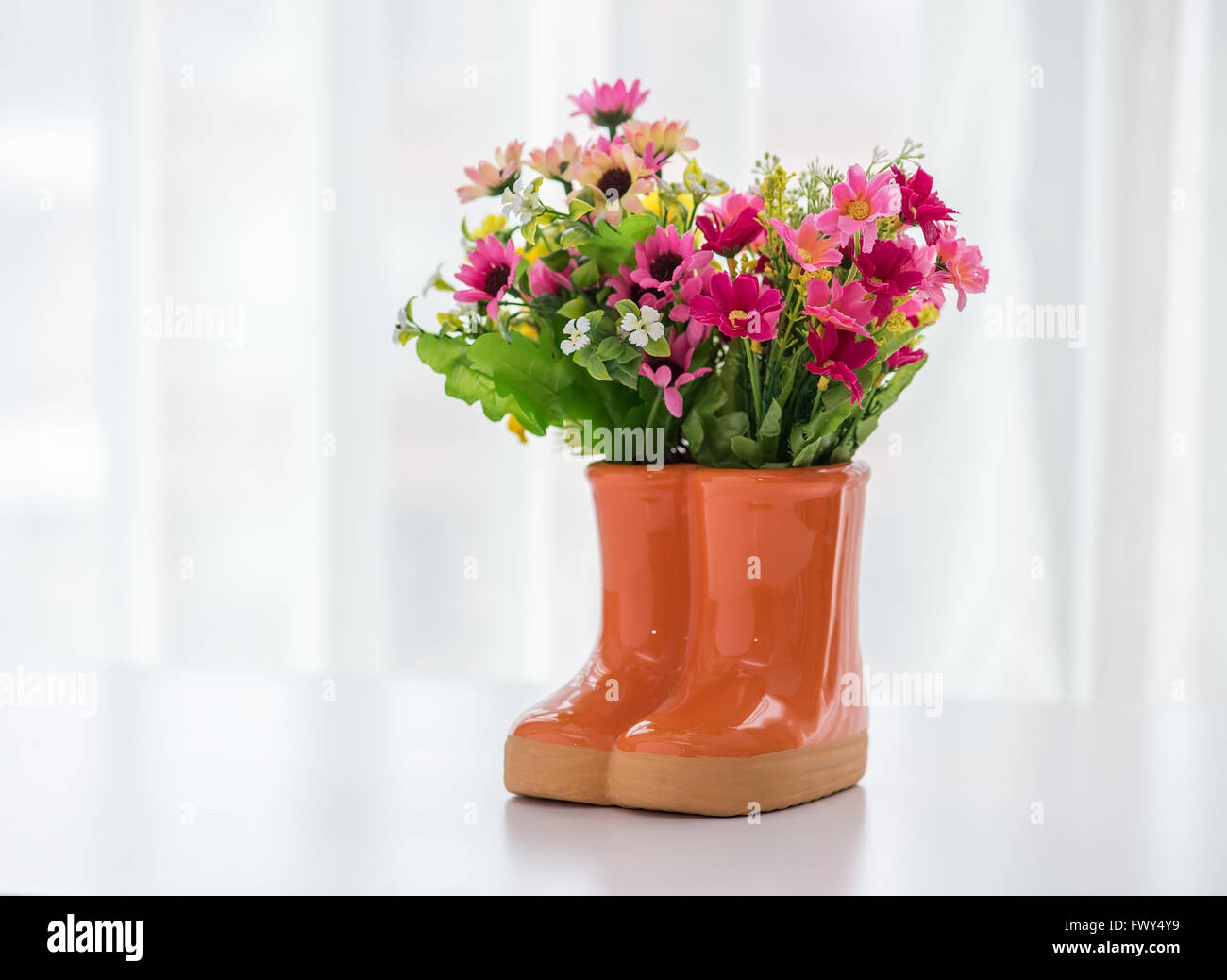 decorations for the garden. boots with flowers Stock Photo