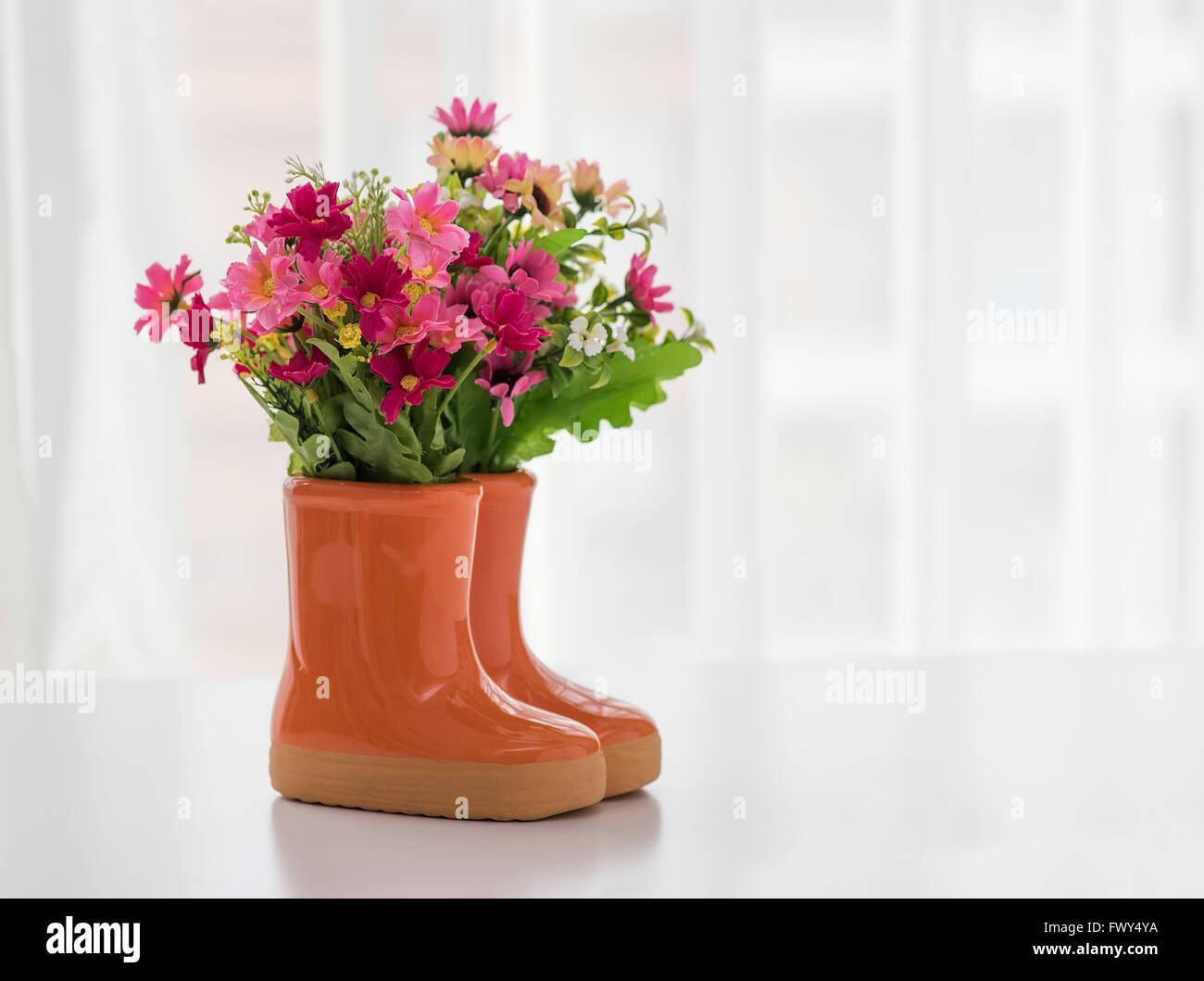 decorations for the garden. boots with flowers Stock Photo