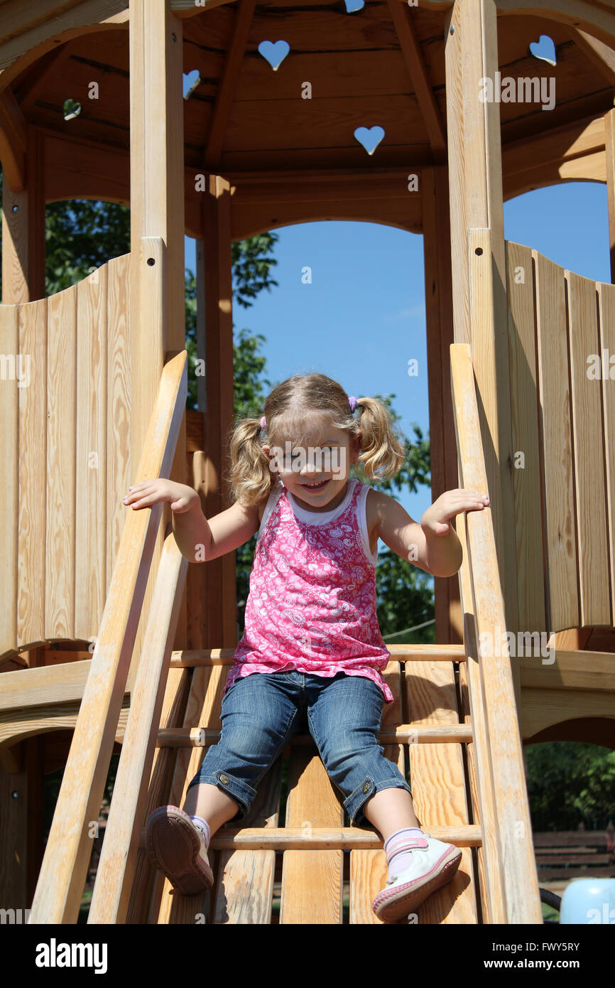 happy little girl on playground Stock Photo - Alamy