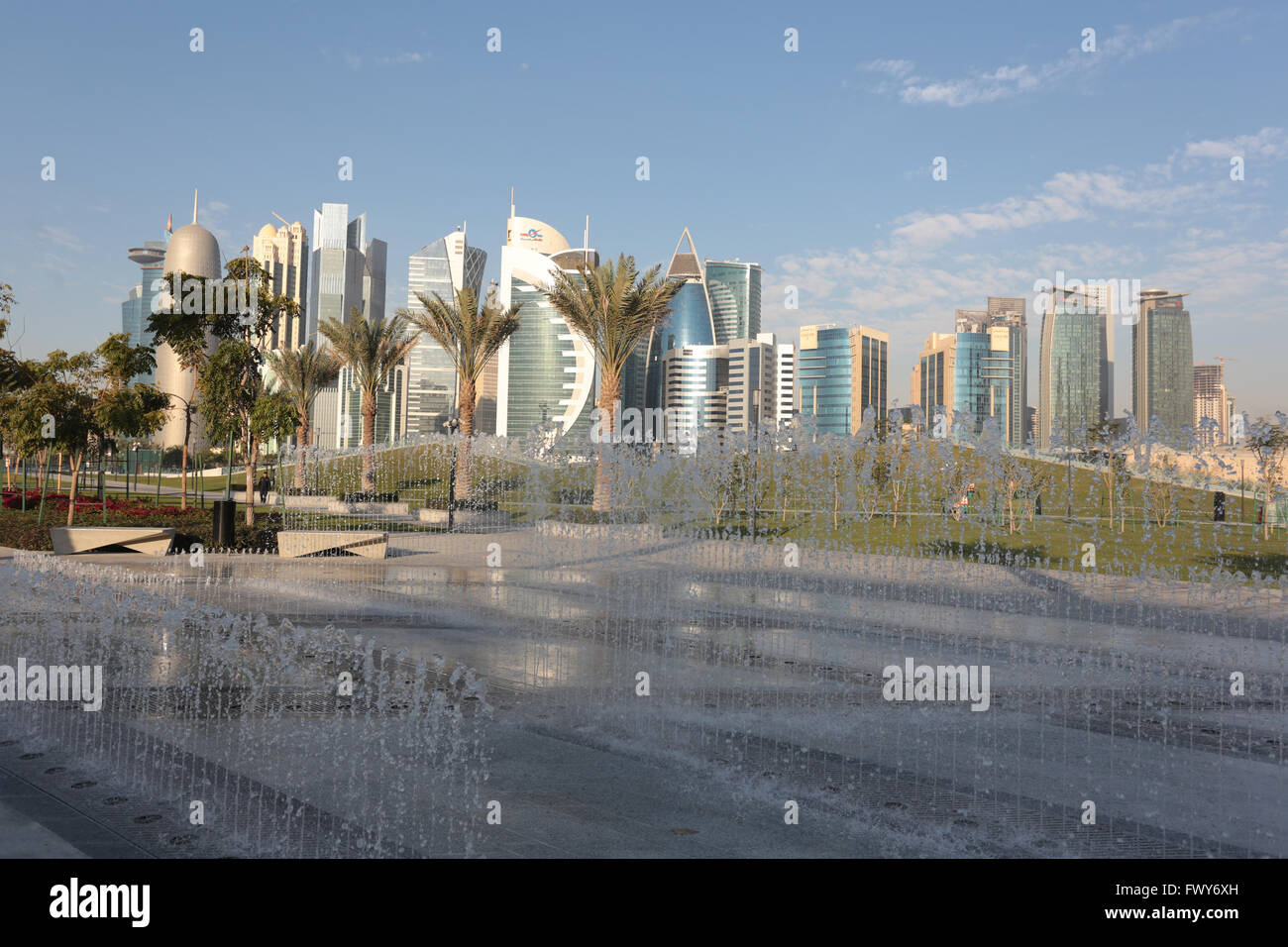 DOHA, QATAR - FEBRUARY 17 2016: The high rise business district of the Qatari Capital, seen from behind a water feature in Hotel Stock Photo