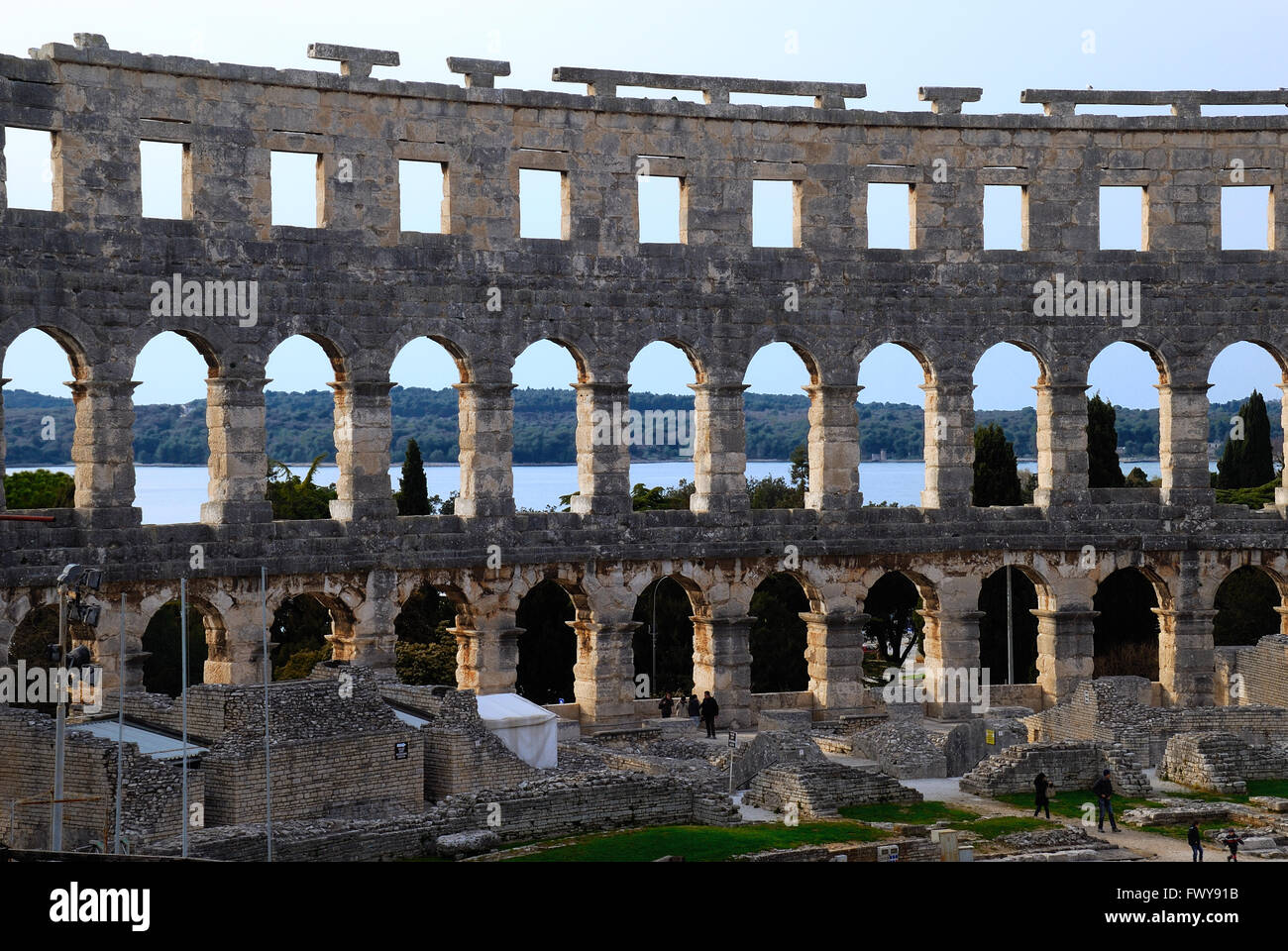 Pula, Istria, Croatia. The Pula Arena is the name of the amphitheatre located in Pula, Croatia. The Arena is the only remaining Roman amphitheatre to have four side towers and with all three Roman architectural orders entirely preserved. It was constructed in 27 BC – 68 AD and is among the six largest surviving Roman arenas in the World. A rare example among the 200 Roman surviving amphitheatres, it is also the best preserved ancient monument in Croatia. The arena is used as a venue for many concerts. Stock Photo