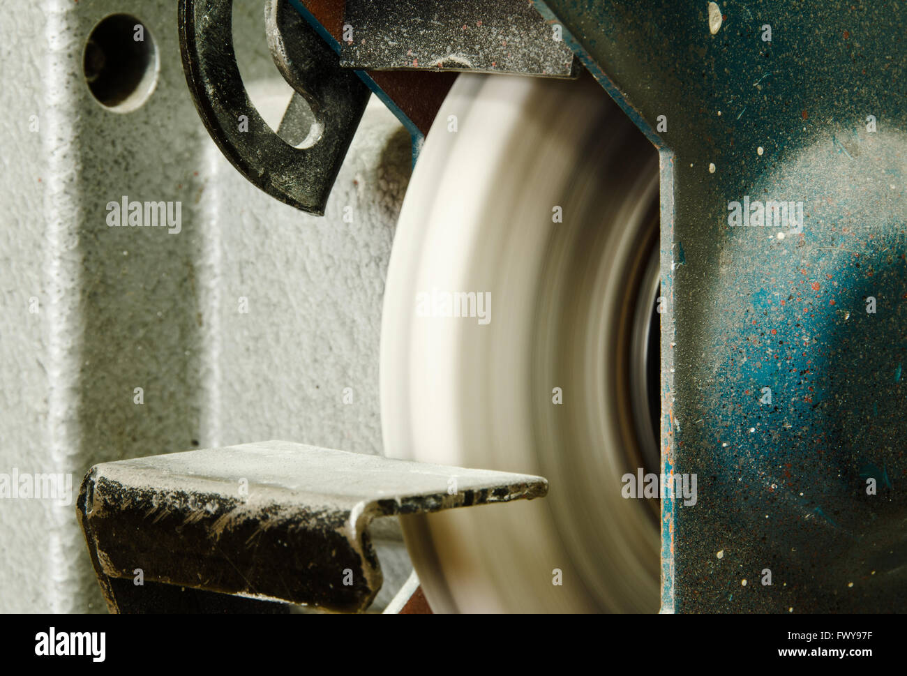 Used blue grinder with rotateing grinding wheel. Stock Photo