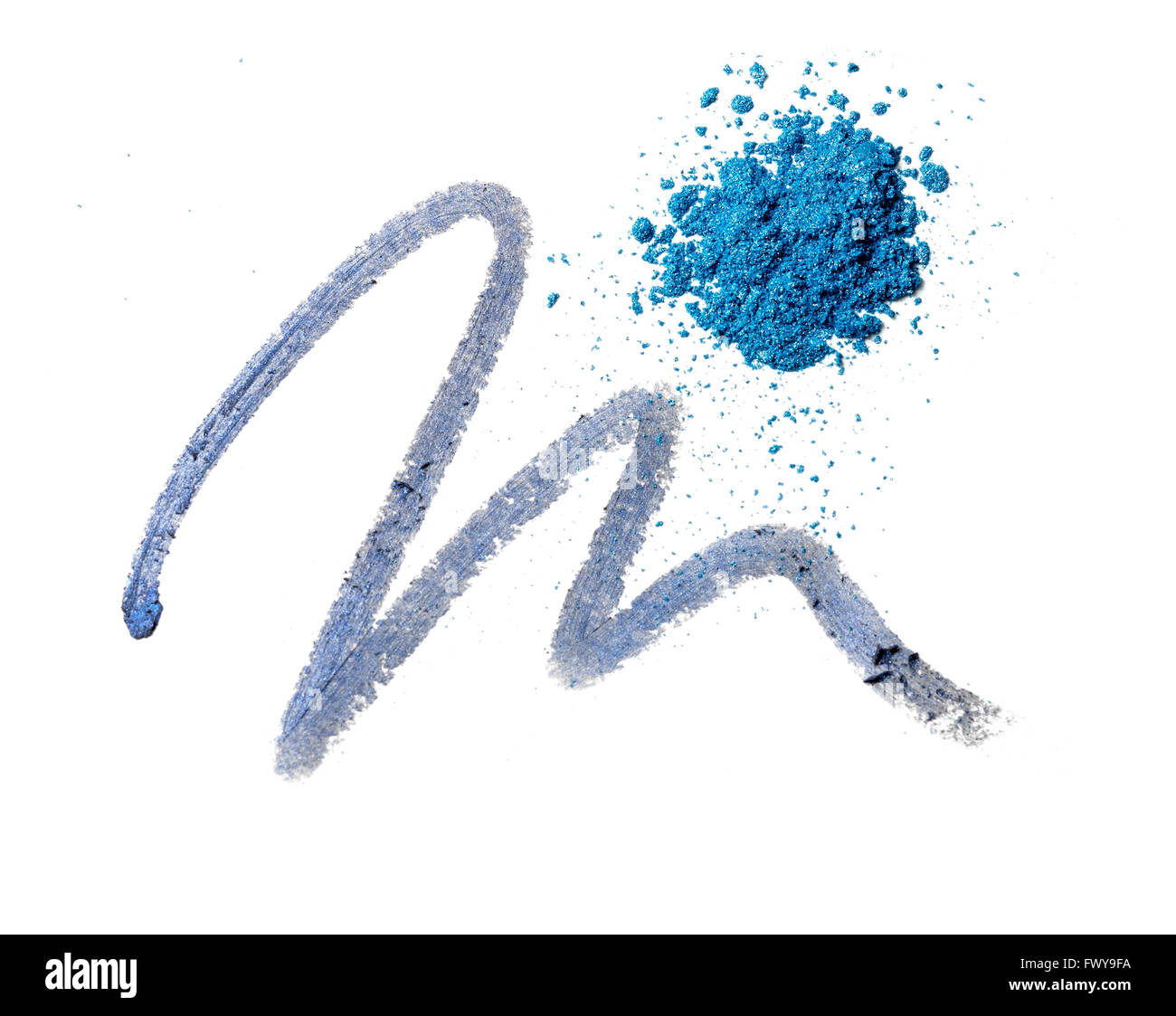 Squiggle of eye pencil and sprinkle of eye shadow Stock Photo