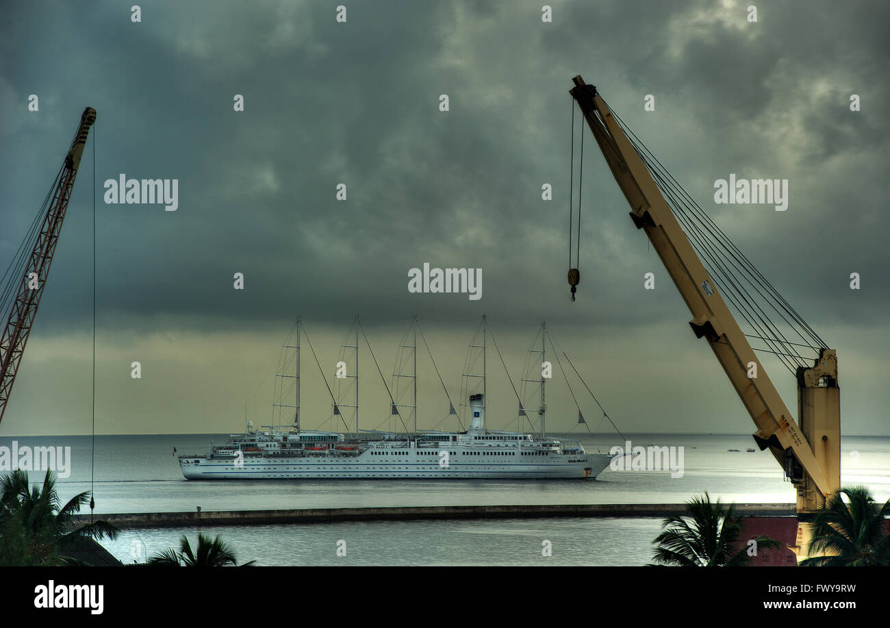 Sailing ship  passing through the port area of Salvador, Baia de Todos Santos (All Saints Bay), Salvador, Bahia, Brazil Stock Photo