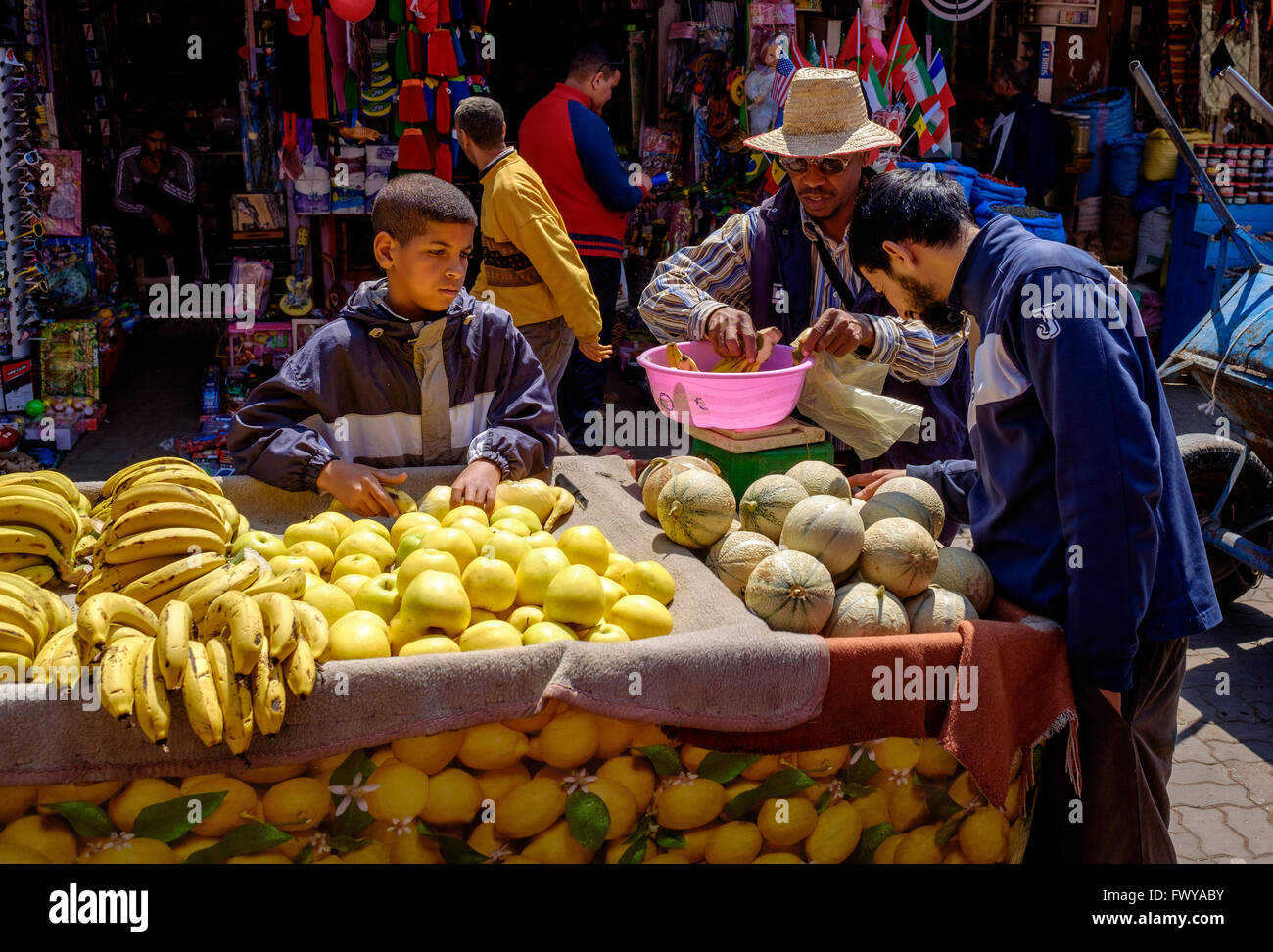 People shopping at a fruit stall in the medina, Marrakech, Morocco, North Africa Stock Photo