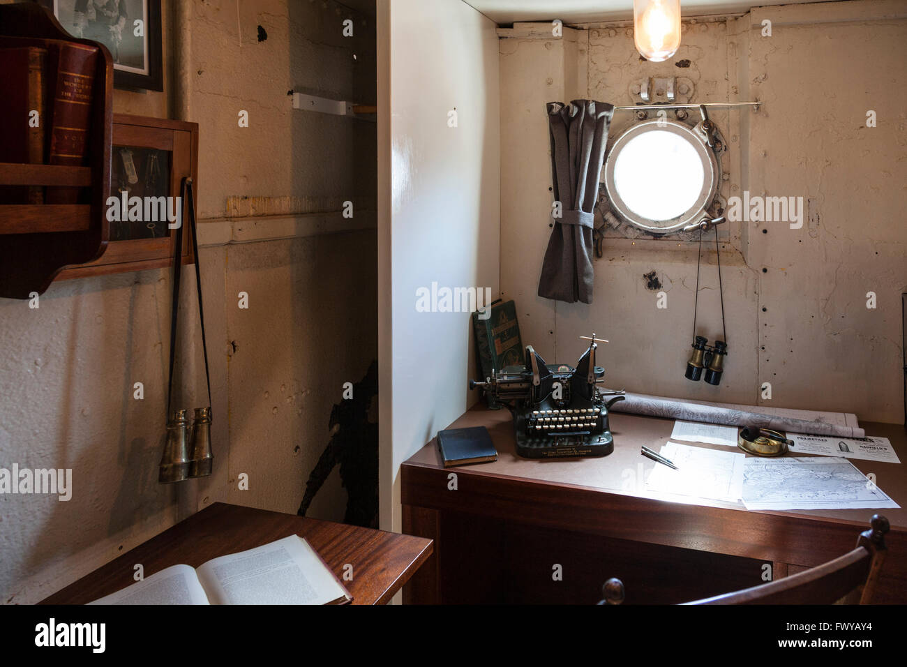 Captain's cabin on board HMS M33 in the Royal Naval Dockyard, Portsmouth. Stock Photo