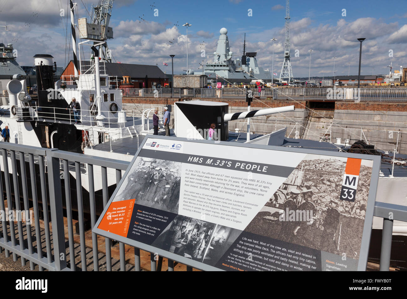 Information panel describing the crew history of HMS M33, an M29-class monitor of the Royal Navy built in 1915. Stock Photo
