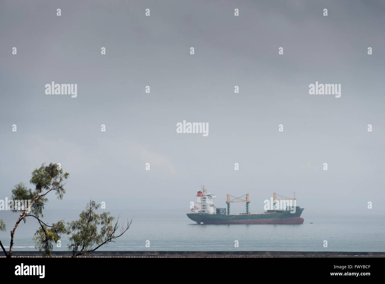 Ship passing through Todos Santos Bay on a cloudy day Stock Photo