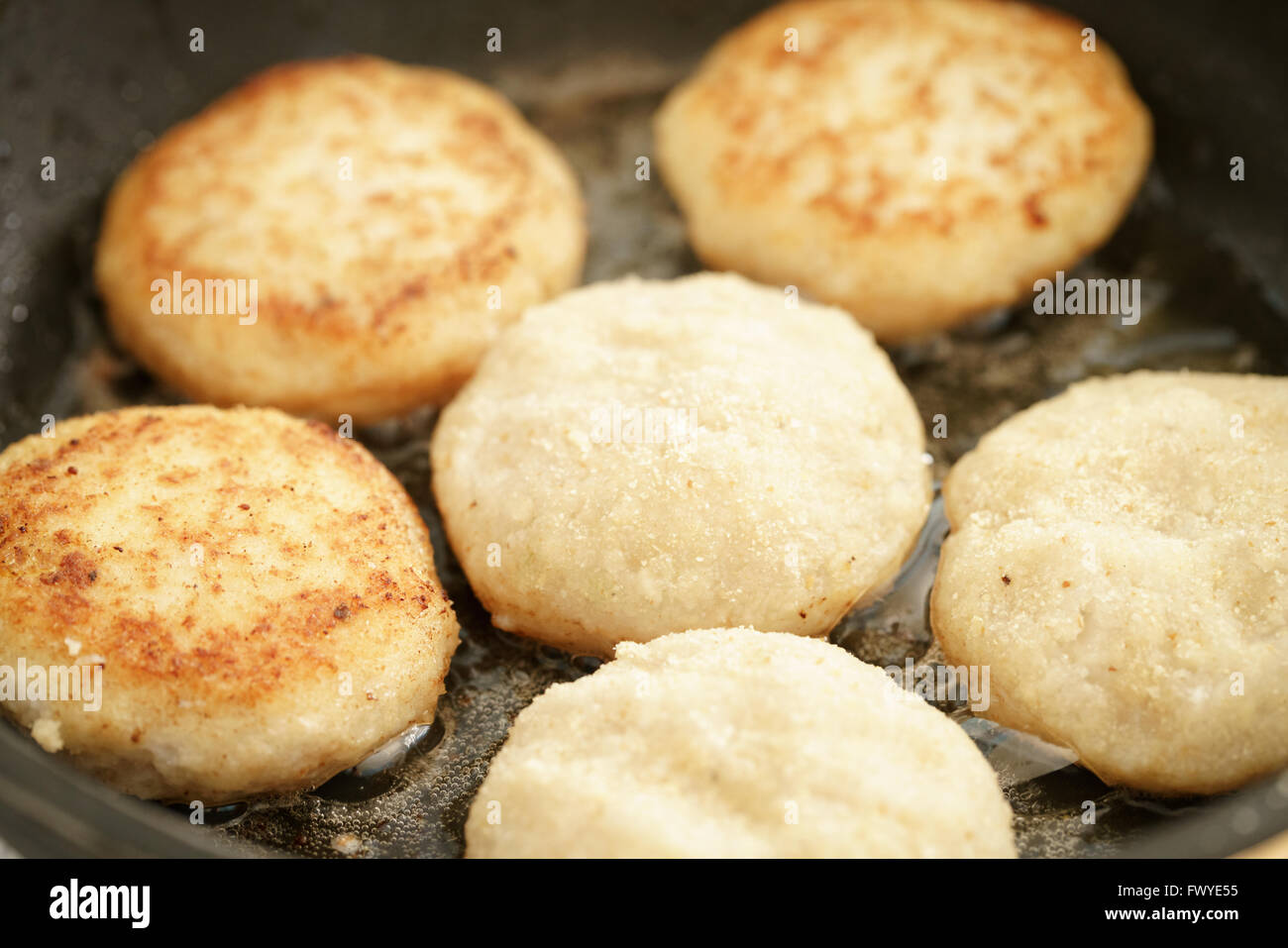 preparing fried fish cakes on pan Stock Photo Alamy