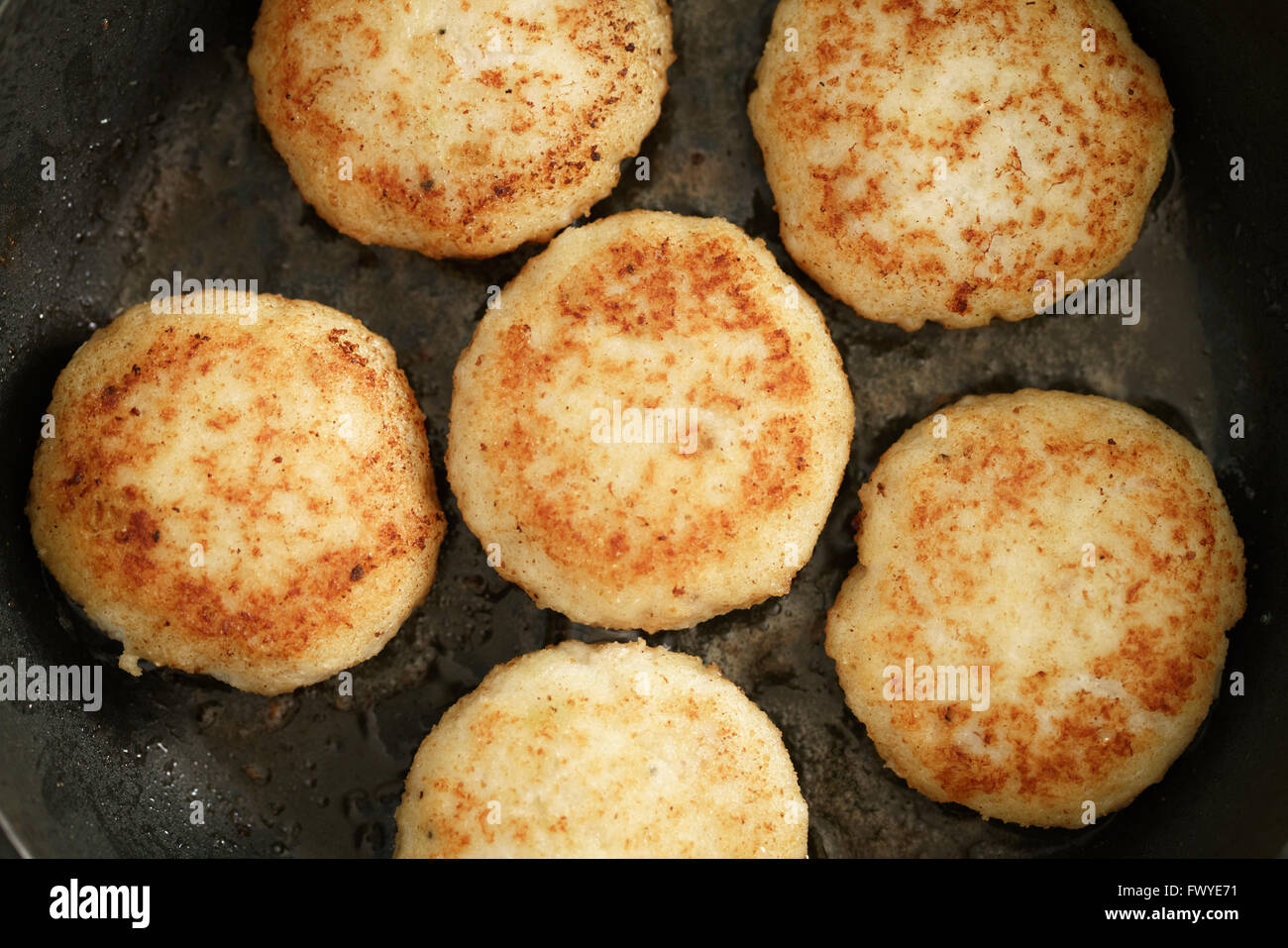 preparing fried fish cakes on pan Stock Photo Alamy