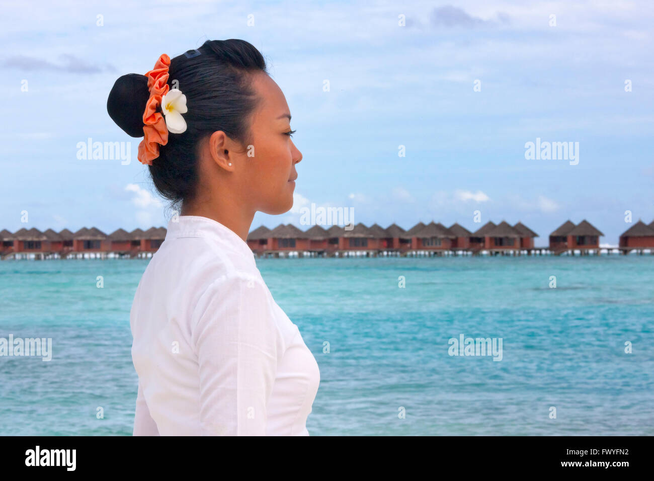 Girl looking at the ocean, Maldives Stock Photo