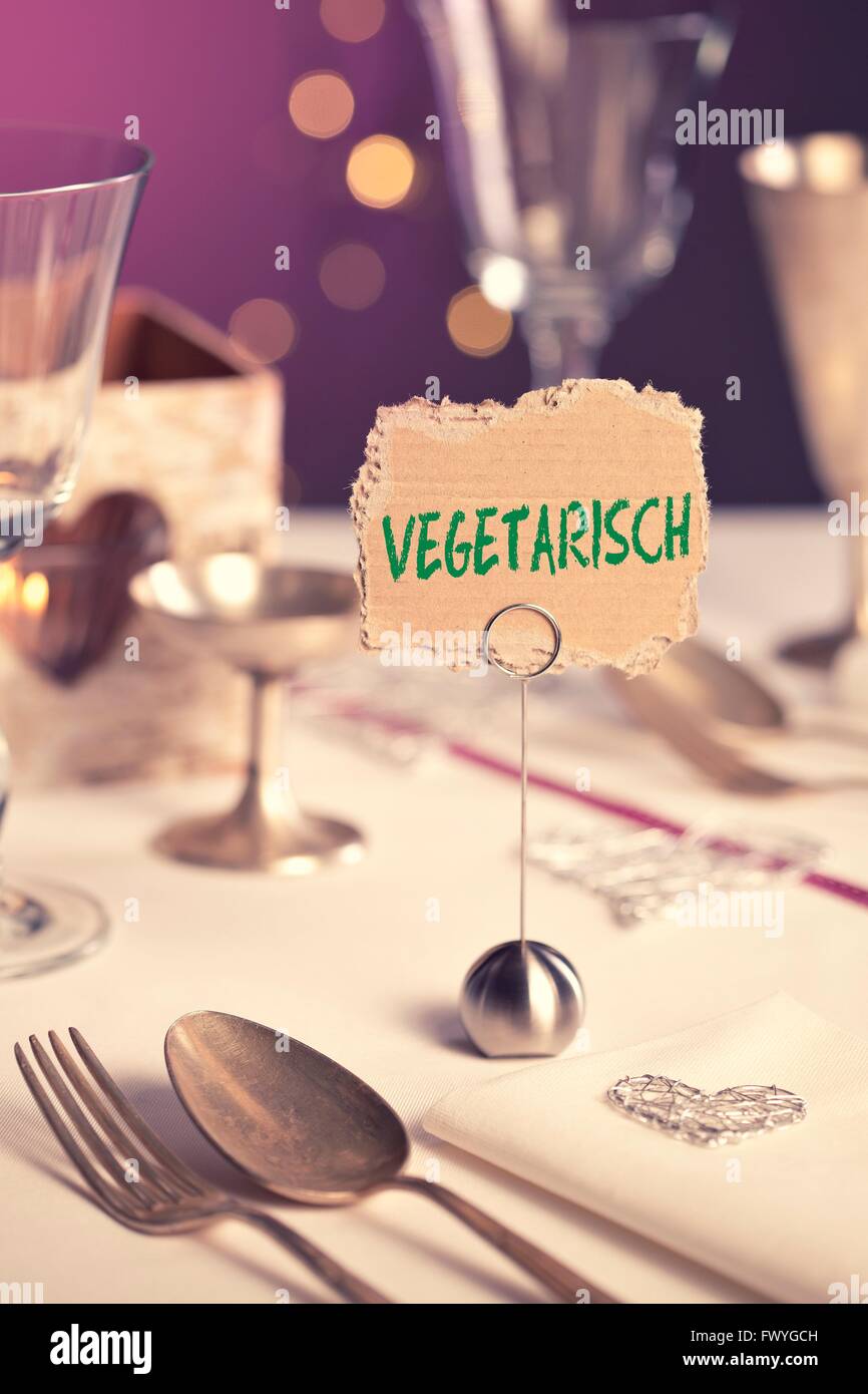 Note on the table that says Vegetarisch or vegetarian Stock Photo