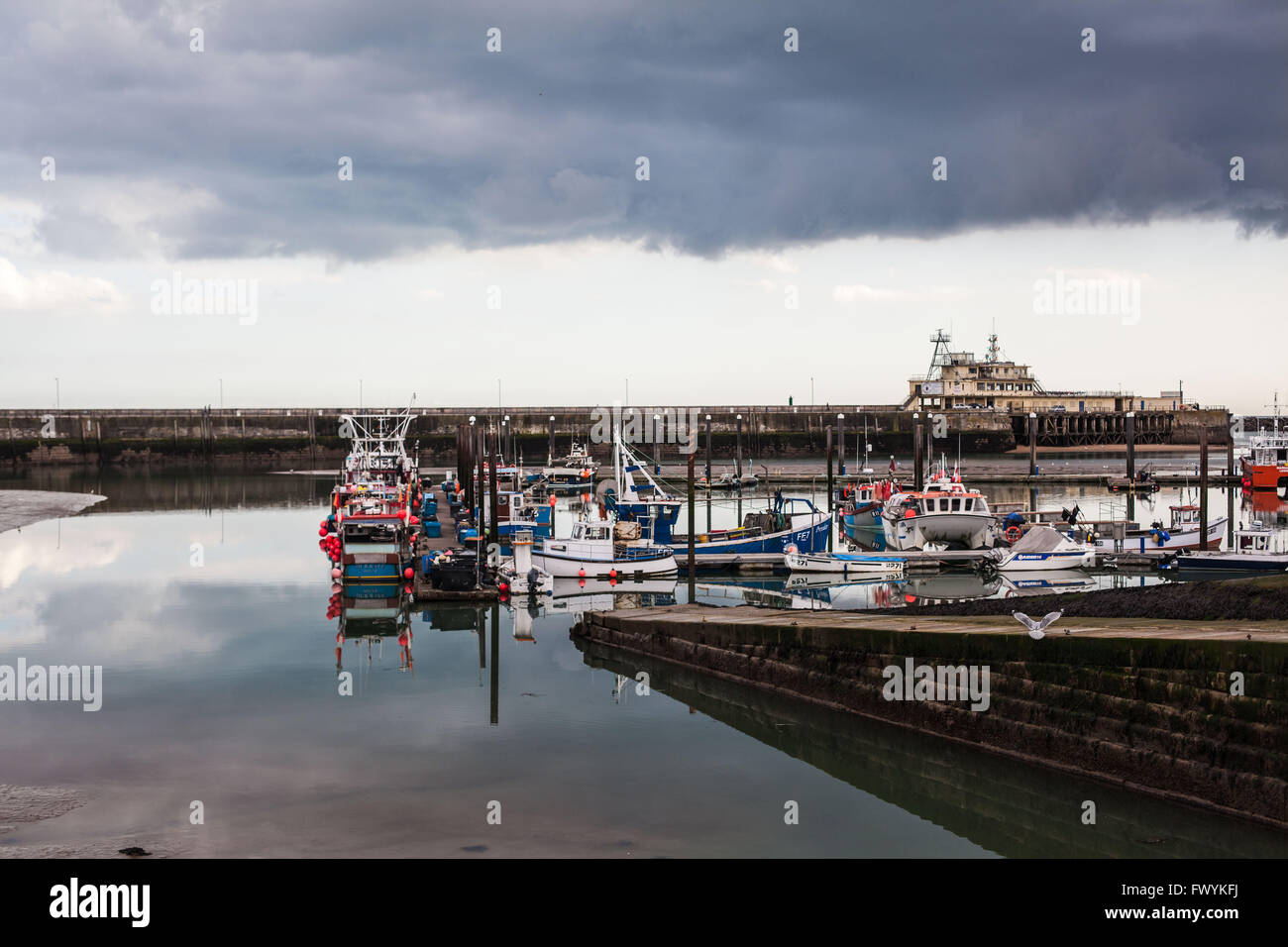 Dark storm clouds contrasting against a clear sky above Ramsgate Harbour, Kent, UK in Spring 2016 Stock Photo