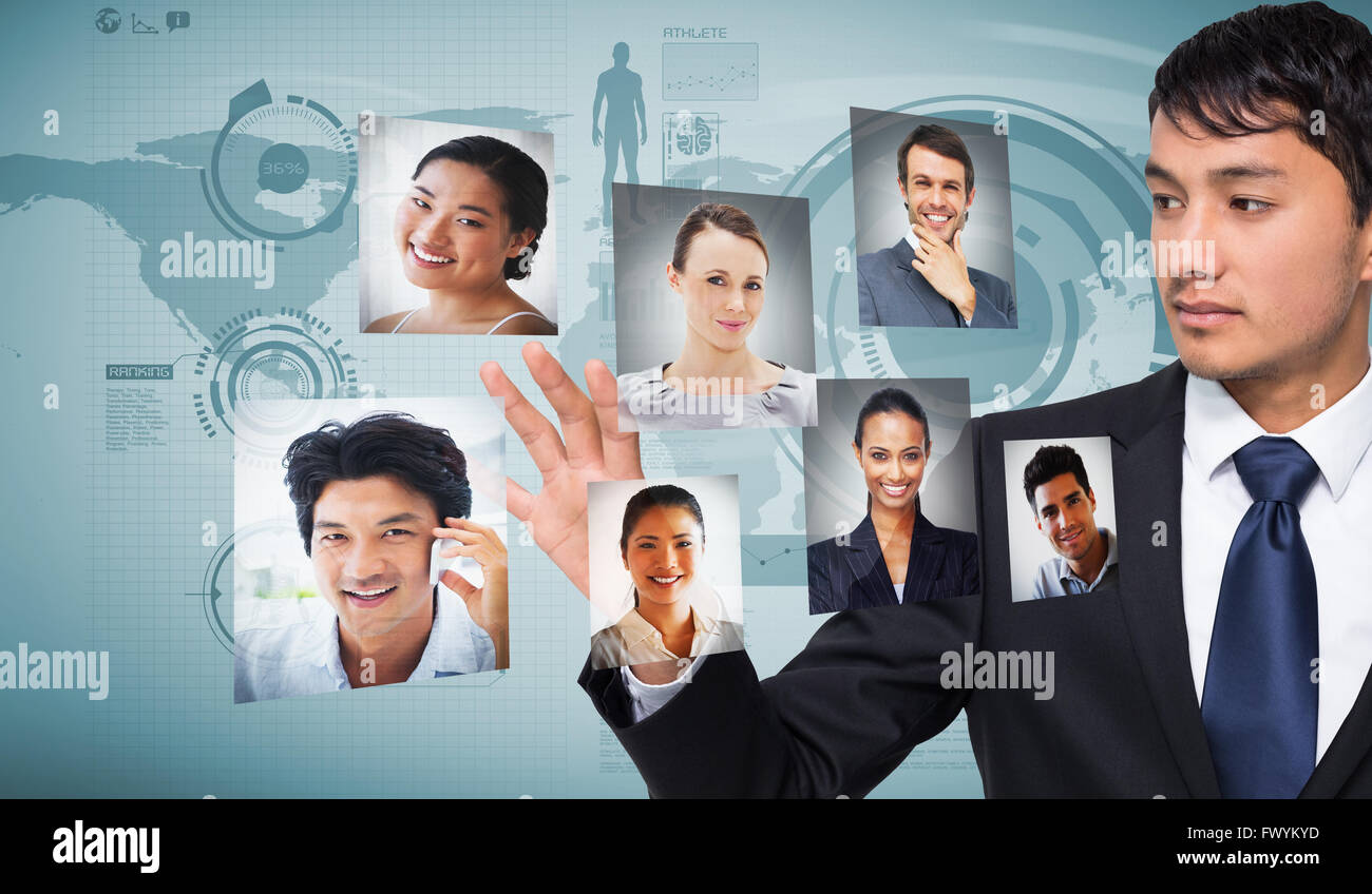 Composite image of unsmiling businessman touching Stock Photo