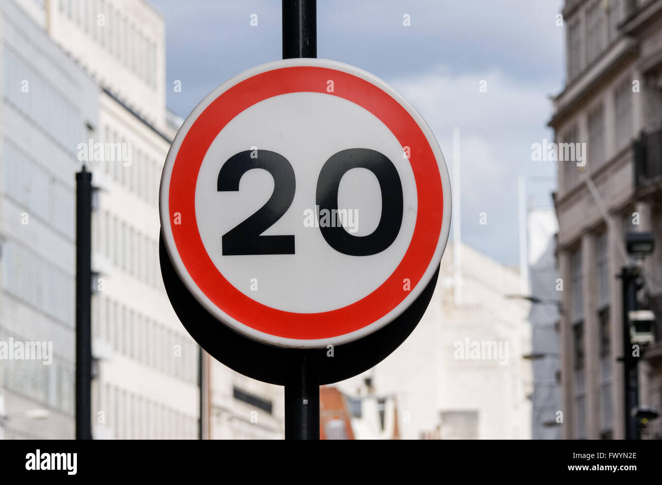 Twenty 20 mph miles per hour speed limit restriction road sign on Fleet Street, London England United Kingdom UK Stock Photo