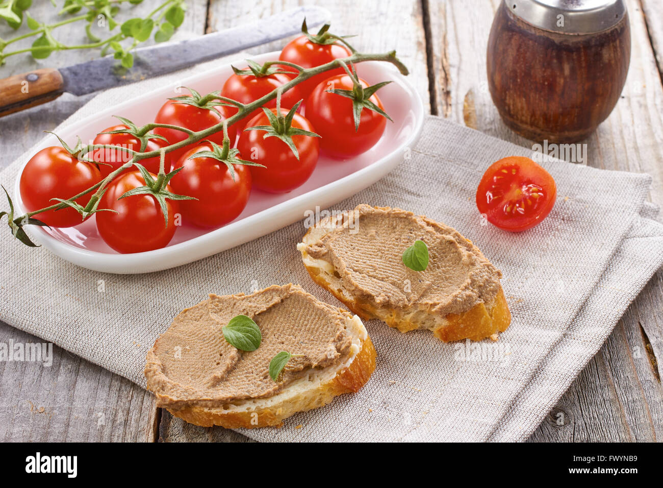 Bread with chicken liver pate and tomatoes Stock Photo