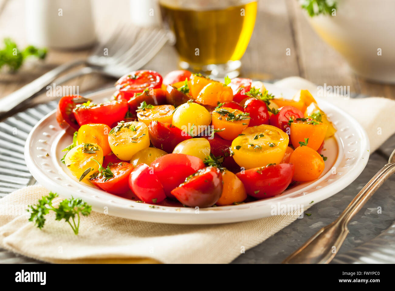 Raw Organic Cherry Tomato Salad with Fresh Herbs Stock Photo
