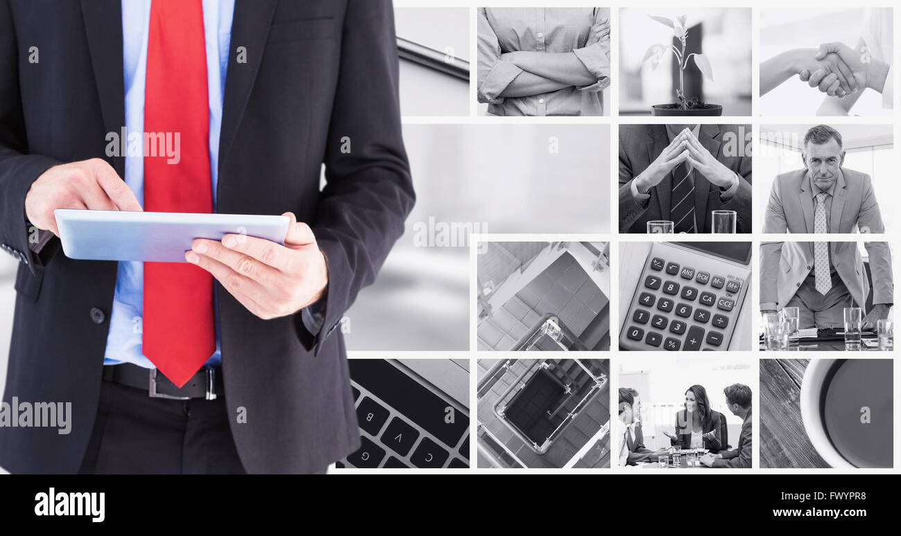 Composite image of businessman scrolling on his digital tablet Stock Photo