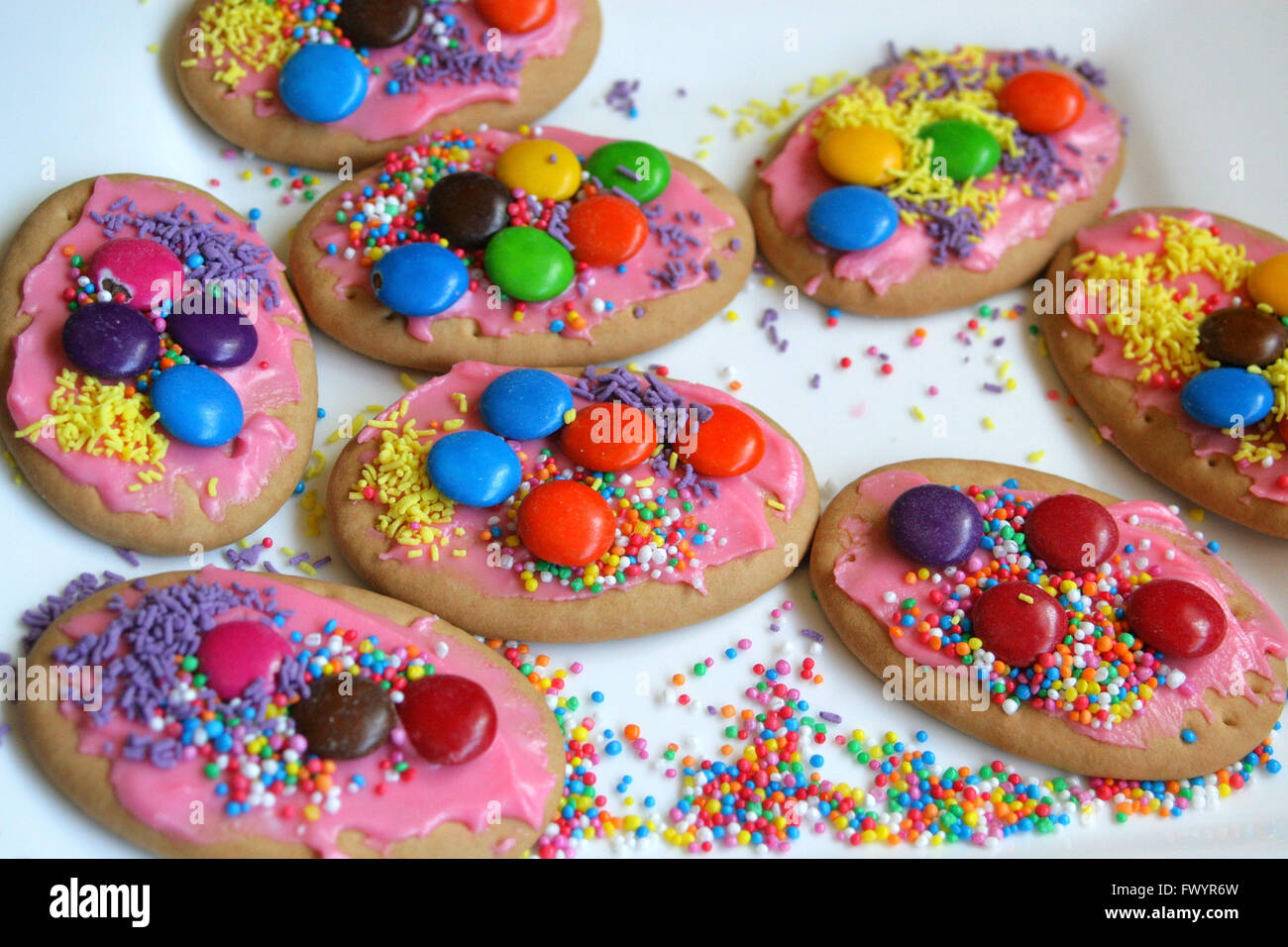 Cookies or biscuits, decorated with sprinkles and candy. Stock Photo