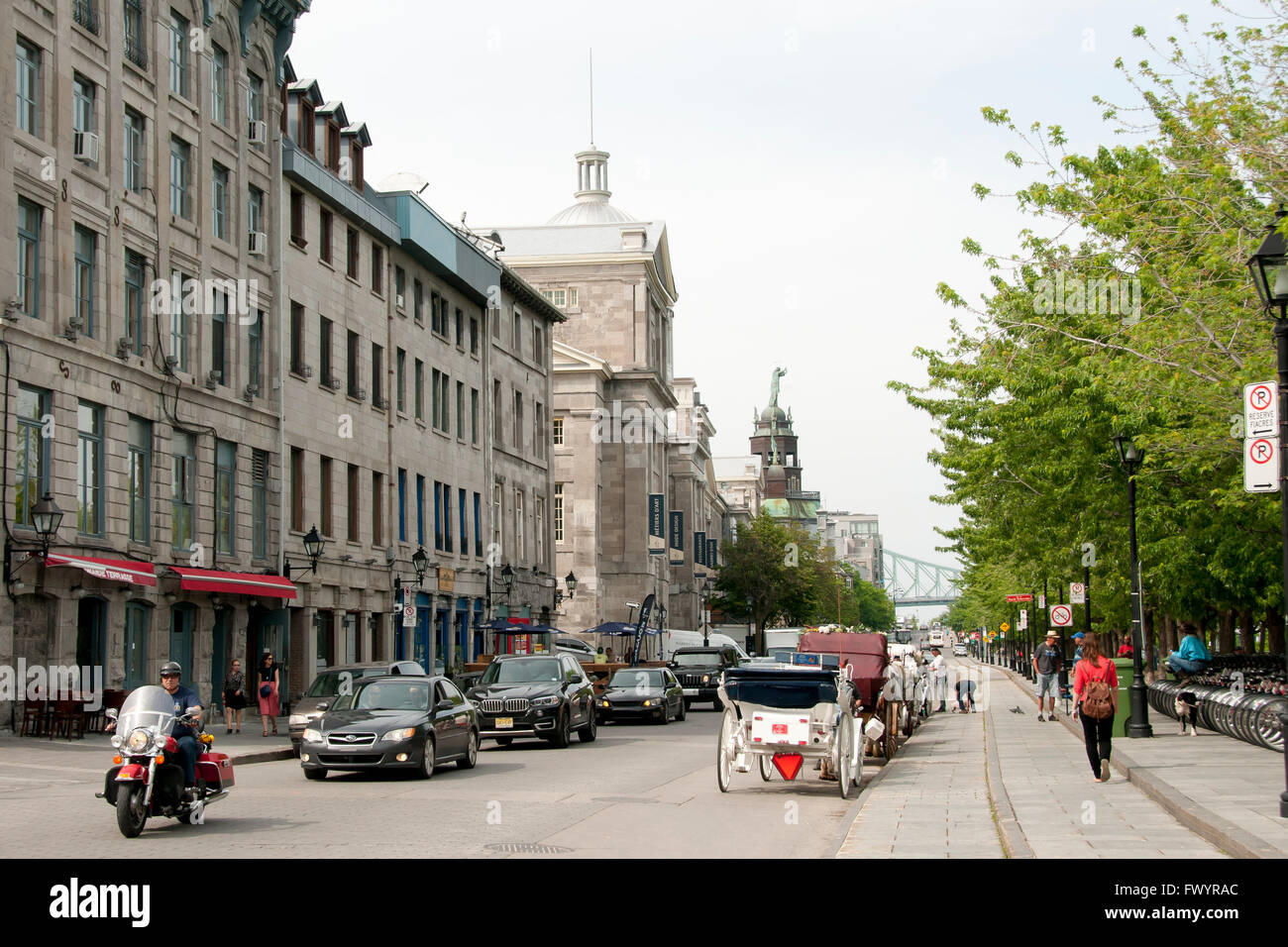 Frequent traffic on 'Rue de la Commune' in the touristic Old Port of Montreal Stock Photo