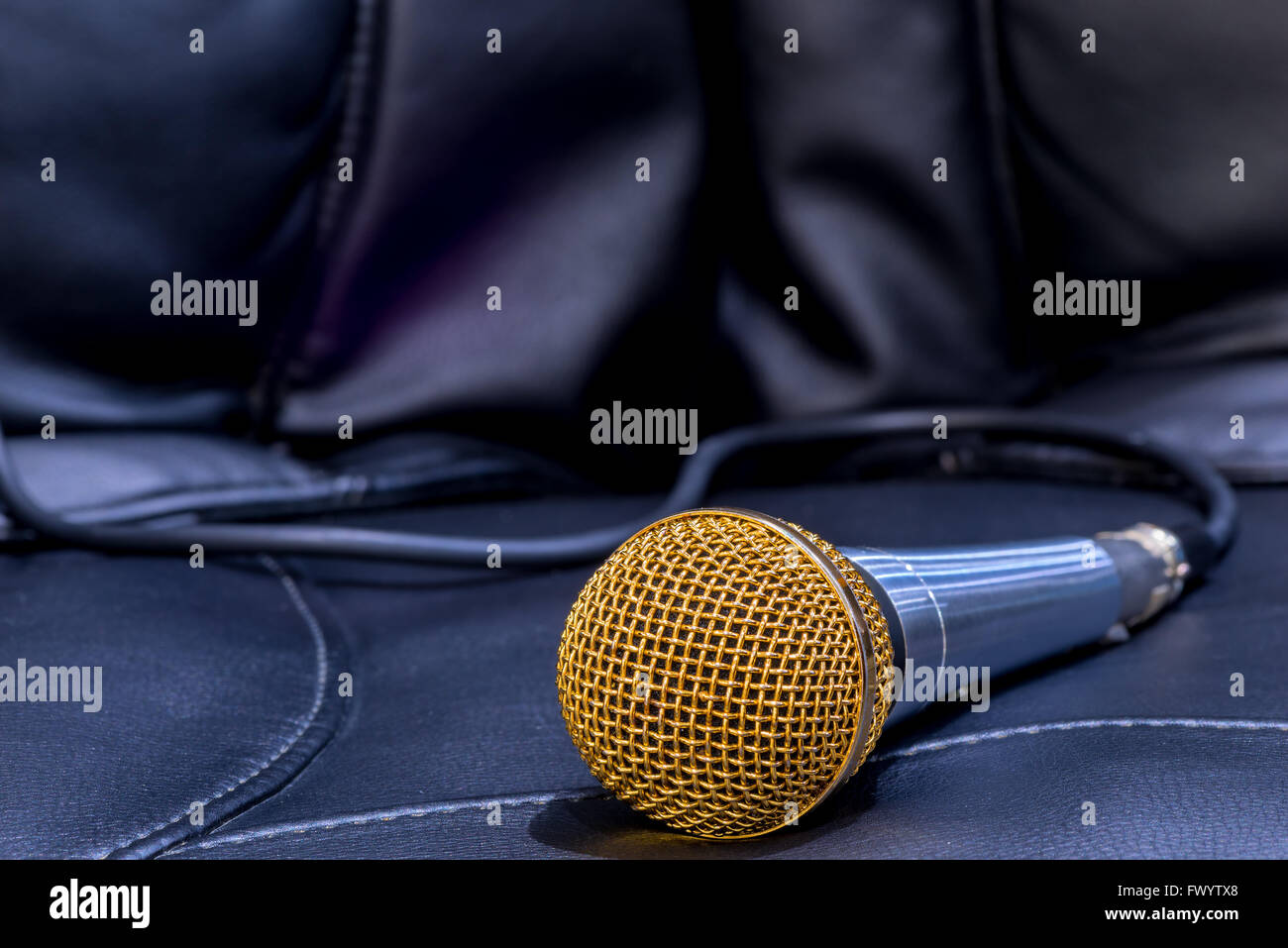 microphone for karaoke close-up on a black background Stock Photo - Alamy