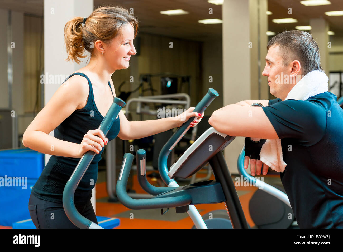 portrait of a girl in the gym and her trainer Stock Photo - Alamy