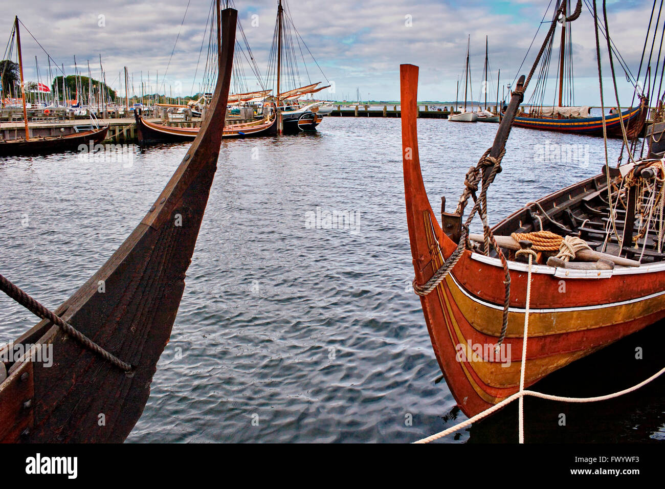 Replicas of Viking longships moored at the jetty of the Viking Ship