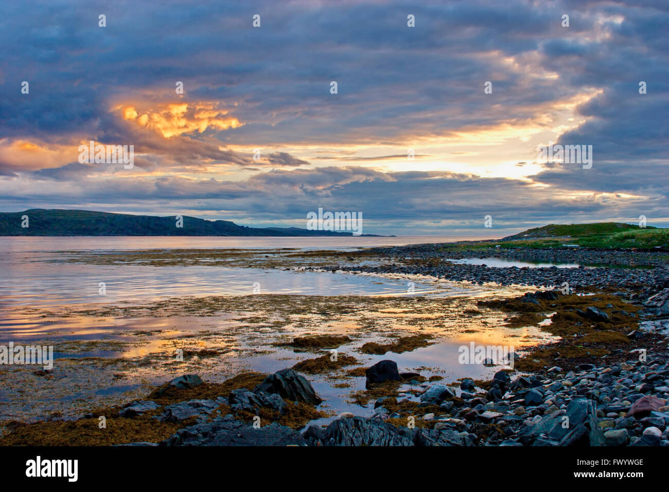 View over Bussesundet from island Vardø in the Varanger-region in arctic Norway at sunset. Stock Photo