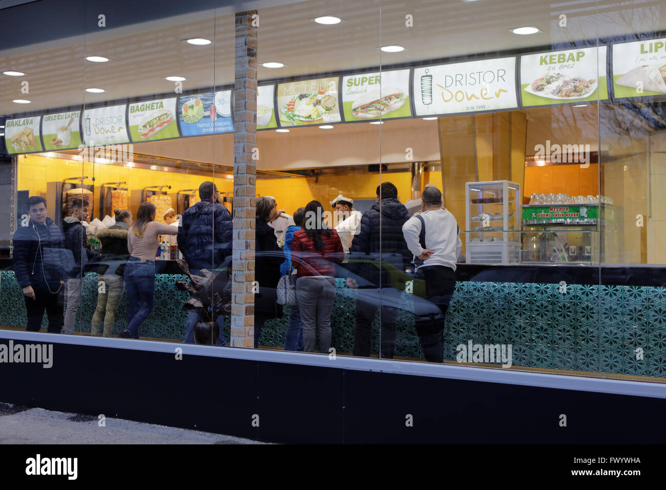 People in the Middle Eastern fast food restaurant Dristor Kebab in  Bucharest, Romania Stock Photo - Alamy