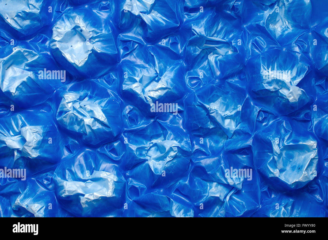 Detail of blue plastic damaged pallet, abstract background Stock Photo