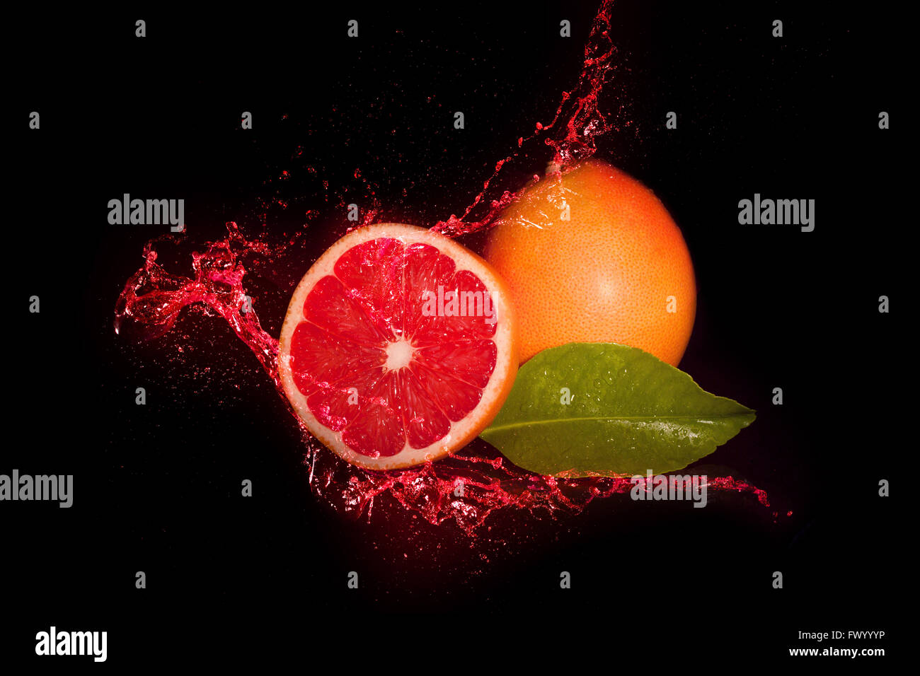 Pink Grapefruit Inside Juice Splash Stock Photo Alamy