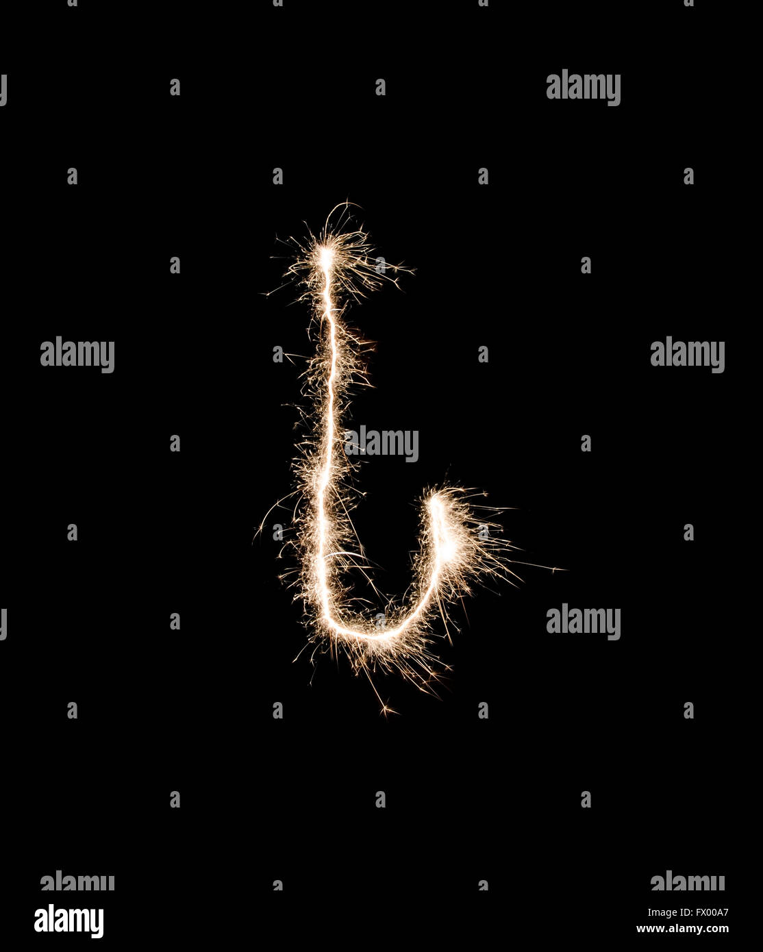 Letter I drew with spakrs on a black background. Stock Photo