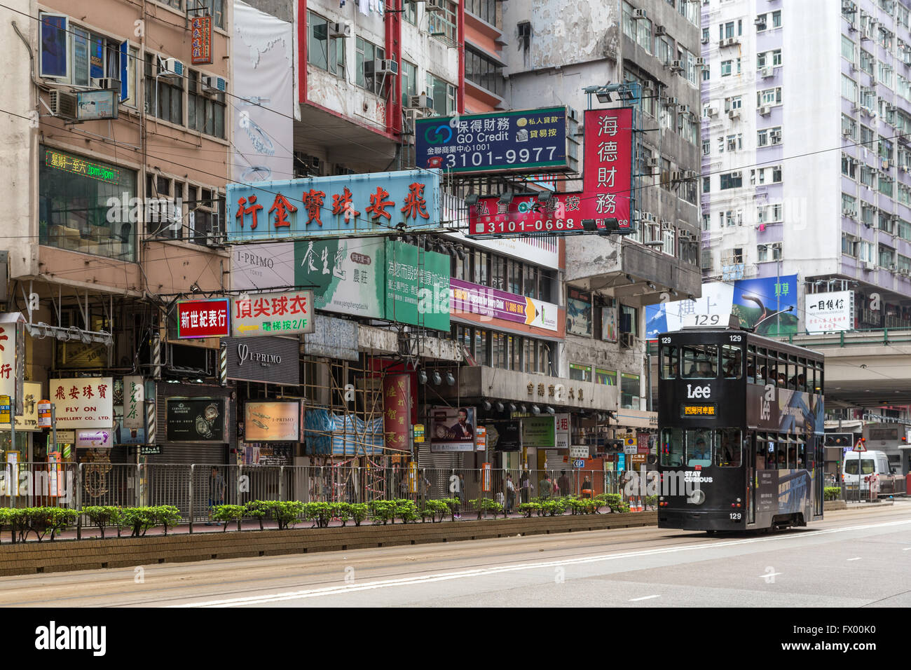 Double-decker tram and buildings at the heavily built-up Causeway Bay in Hong Kong, China. Stock Photo