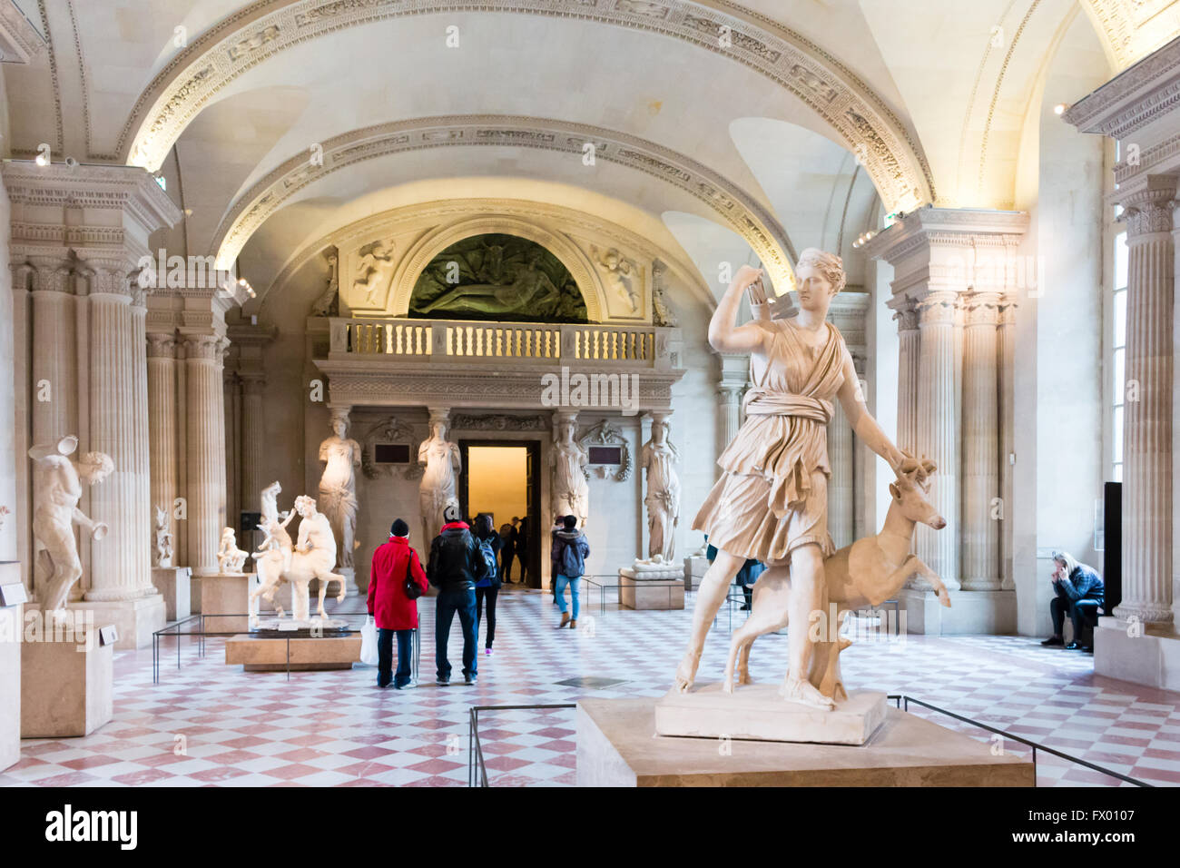 Salle des Caryatides in Musee du Louvre. The Diana of Versailles sculpture on the front. Paris