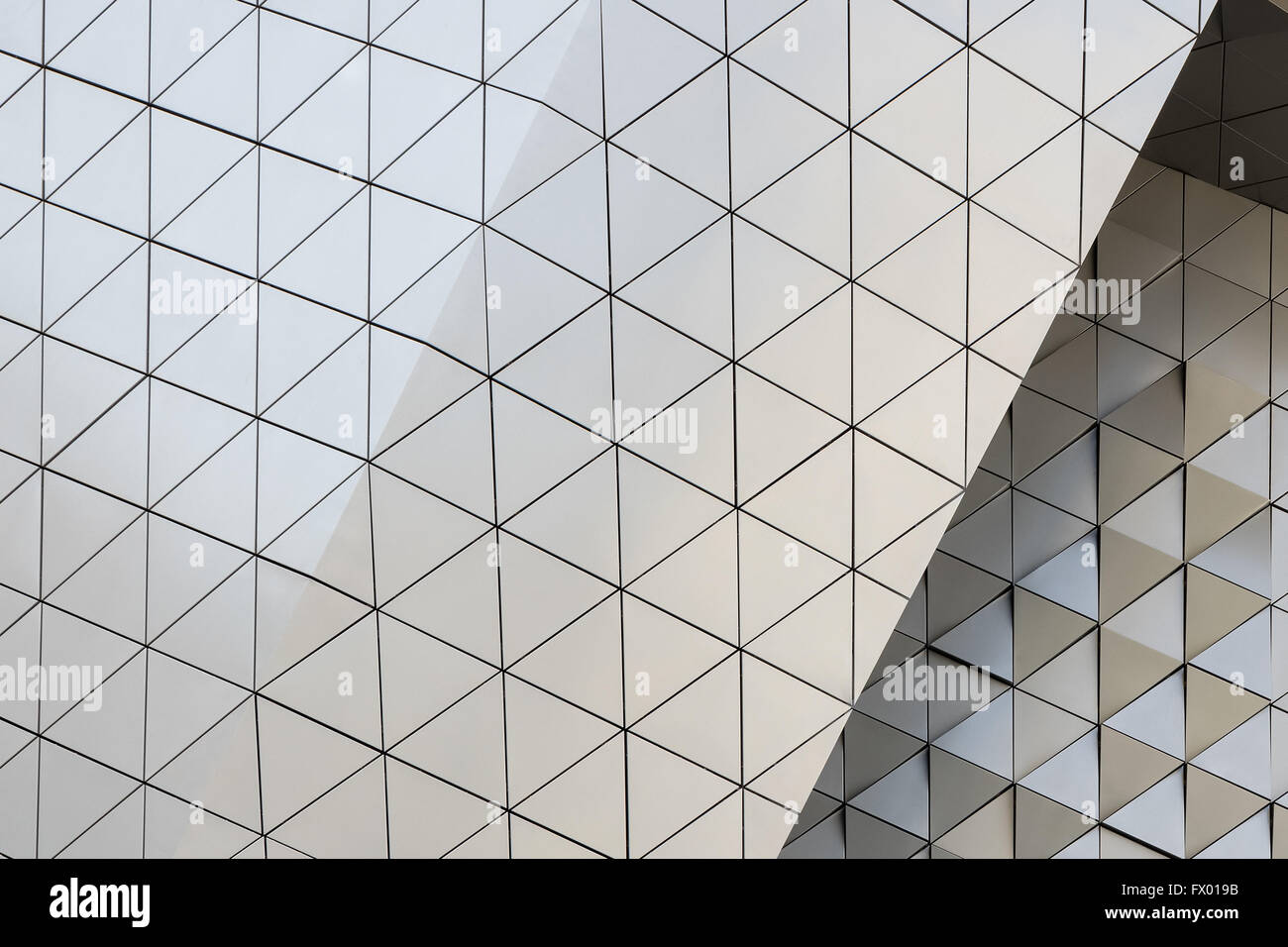 Abstract close-up view of modern aluminum ventilated facade of triangles Stock Photo