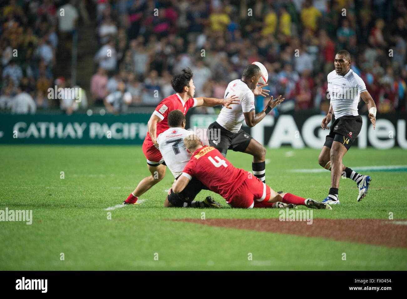 Hong Kong, China. 8, April, 2016. HSBC World Rugby Sevens Series-round 7, Hong Kong Stadium.  Canada (red) vs Fiji in the opening rounds. Fiji wins 19-17. Credit:  Gerry Rousseau/Alamy Live News Stock Photo