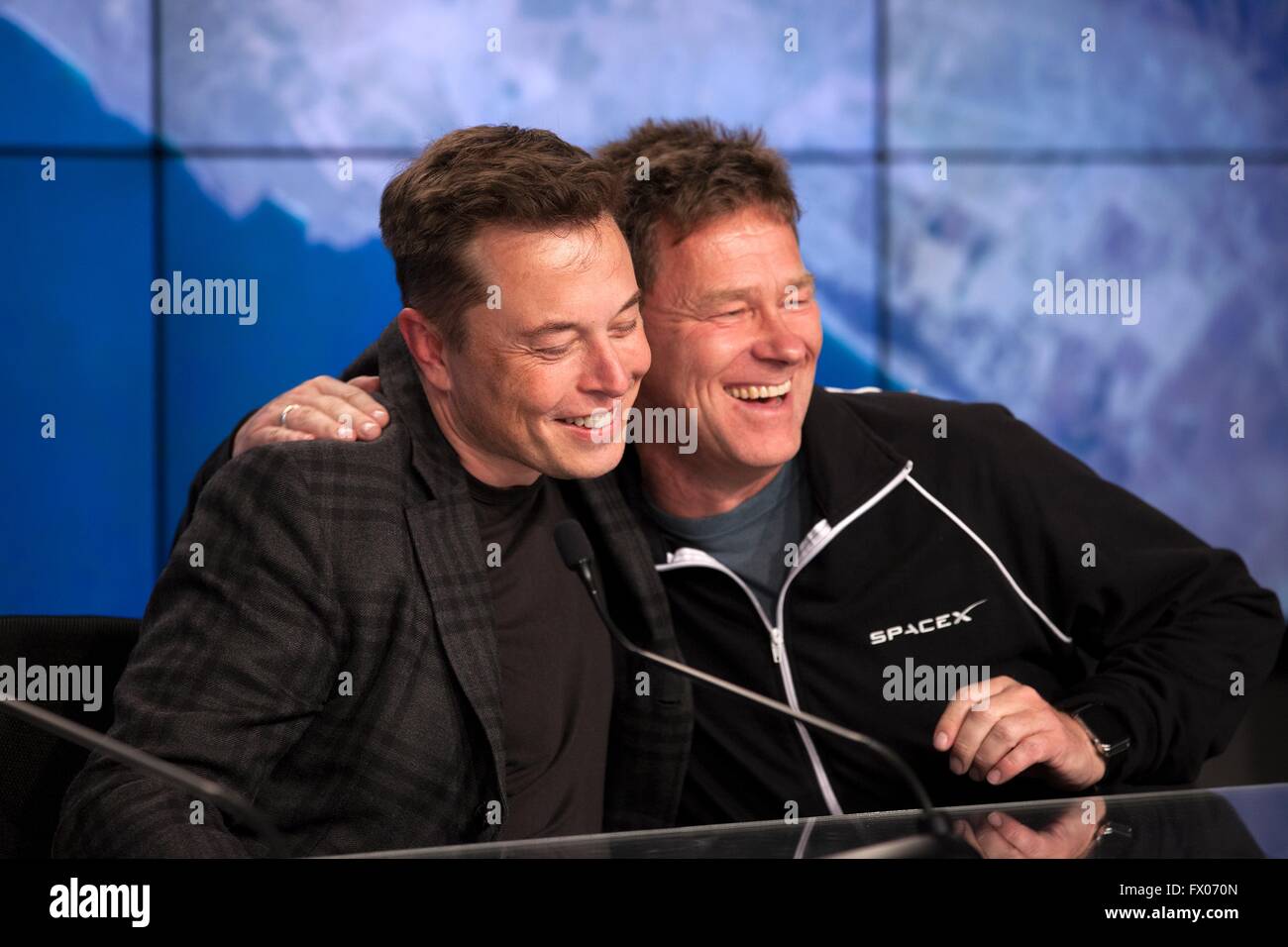 Cape Canaveral, Florida, USA. 08th Apr, 2016. Billionaire and CEO of SpaceX Elon Musk is embraced by Hans Koenigsmann, SpaceX vice president of Mission Assurance following the successful launch of the Falcon 9 carrying the Dragon cargo capsule at the Kennedy Space Center April 8, 2016 in Cape Canaveral, Florida. The CRS-8 mission to the International Space Station launched and then returned to land for the first time on a barge at sea. Credit:  Planetpix/Alamy Live News Stock Photo