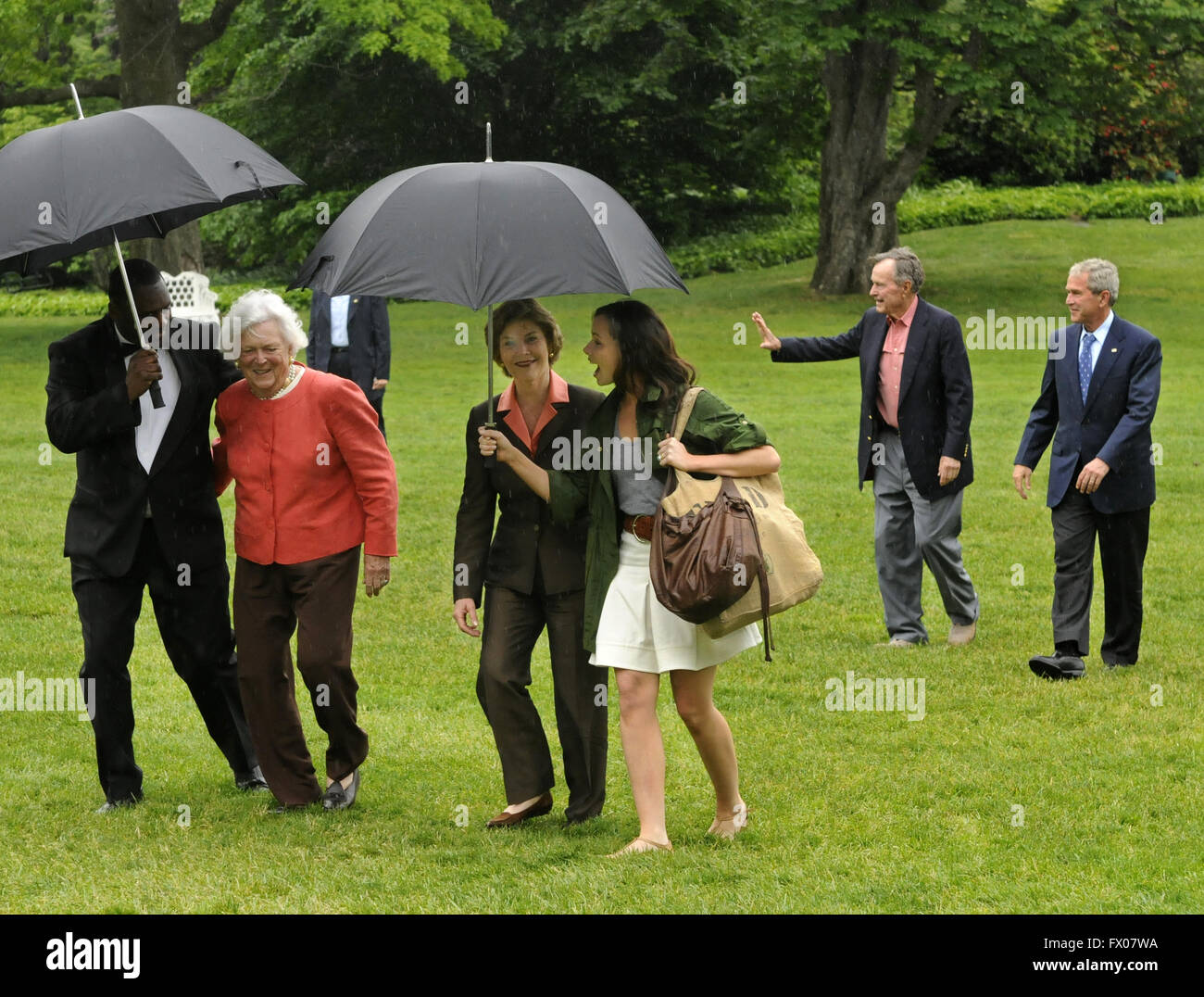 May 11, 2008 - Washington, District of Columbia, United States of America - Former United States President George H.W. Bush (2nd, R) walks with US President George W. Bush as an aide assists former first lady Barbara Bush and first lady Laura Bush (C) walks with daughter Barbara, as they arrive at the White House from a weekend at the Crawford, Texas ranch, 11 May 2008 in Washington, DC. Bush, whose daughter Jenna married Henry Hager at the ranch, described the experience as 'spectacular' and 'it's all we could have hoped for'. Credit: Mike Theiler/Pool via CNP (Credit Image: © Mike The Stock Photo