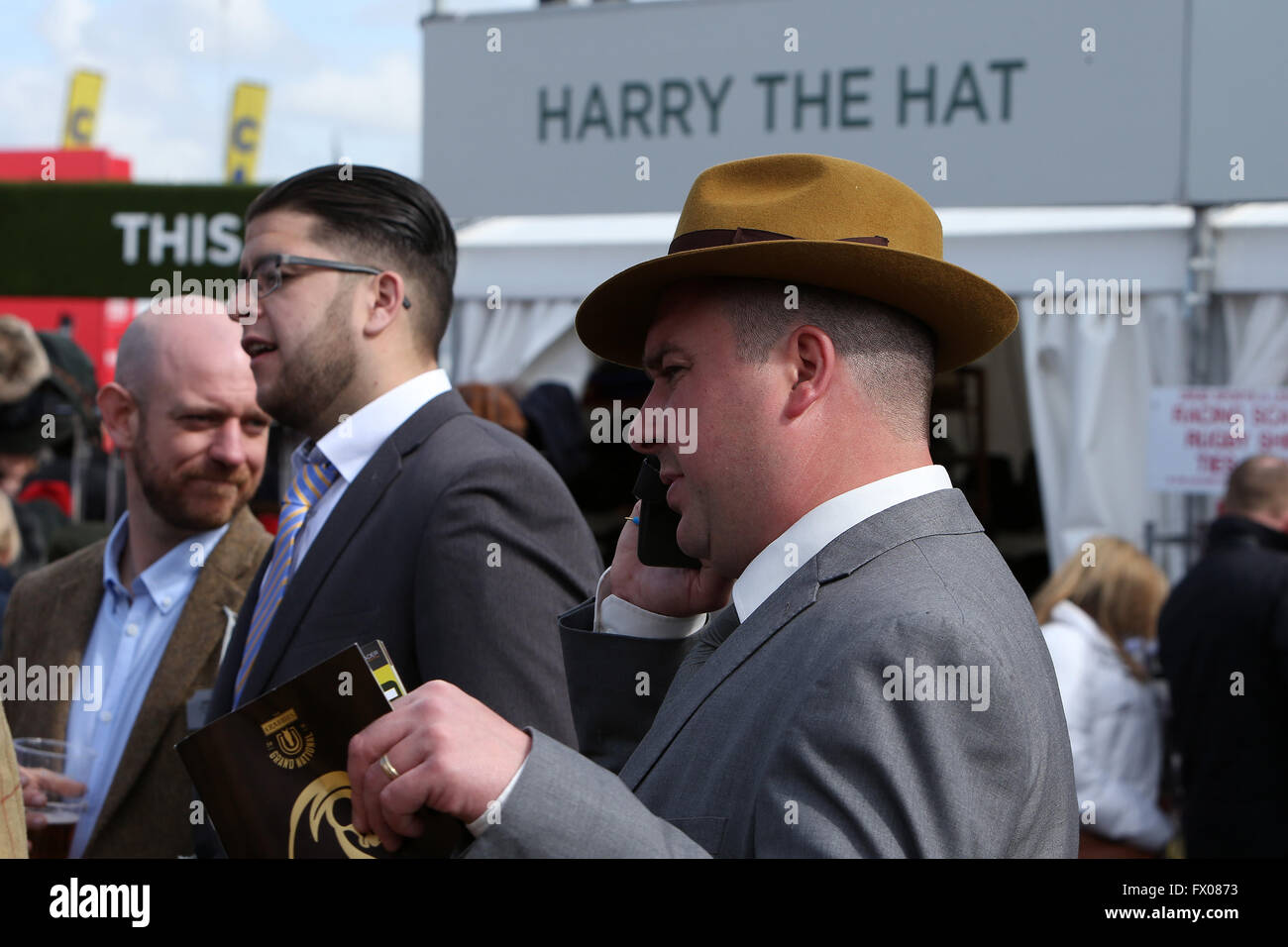 Aintree, Liverpool, UK. 09th Apr, 2016. Crabbies Grand National Festival Day 3. Racing fan deliberates his choice of headwear. Credit:  Action Plus Sports/Alamy Live News Stock Photo