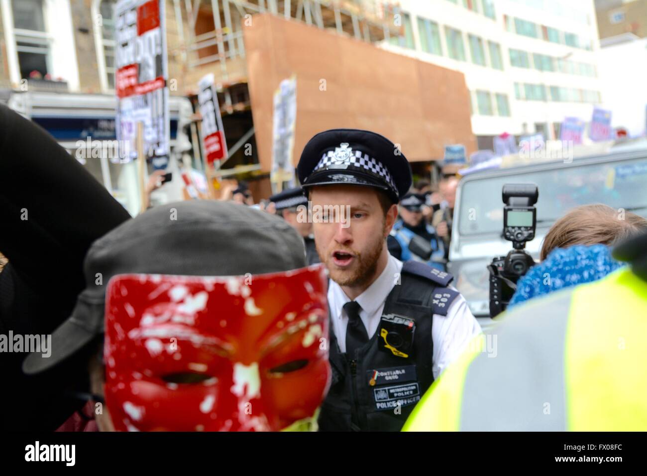 London, UK. 9th April 2016. Scuffles as police force back crowds as a car from the Conservate Party tries to leave. Credit: Marc Ward/Alamy Live News Stock Photo