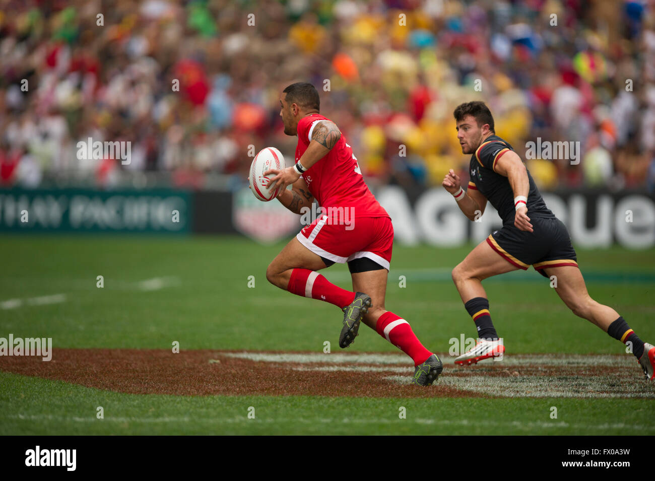 Hong Kong, China. 9, April, 2016. HSBC World Rugby Sevens Series-round 7, Hong Kong Stadium.  Wales vs Canada (red). Wales wins 24-10. Credit:  Gerry Rousseau/Alamy Live News Stock Photo
