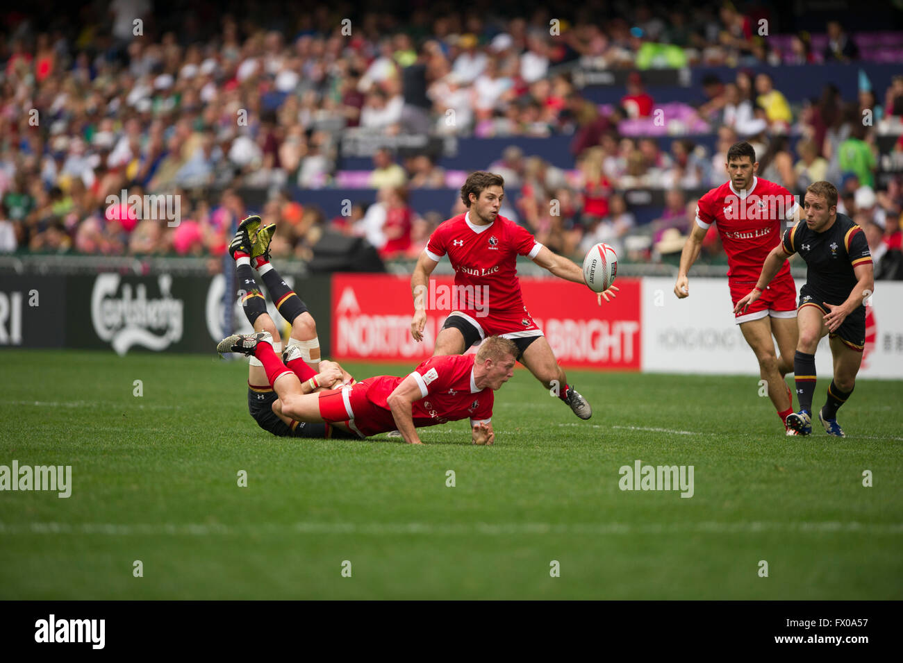 Hong Kong, China. 9, April, 2016. HSBC World Rugby Sevens Series-round 7, Hong Kong Stadium. Wales vs Canada (red). Wales wins 24-10. Credit:  Gerry Rousseau/Alamy Live News Stock Photo