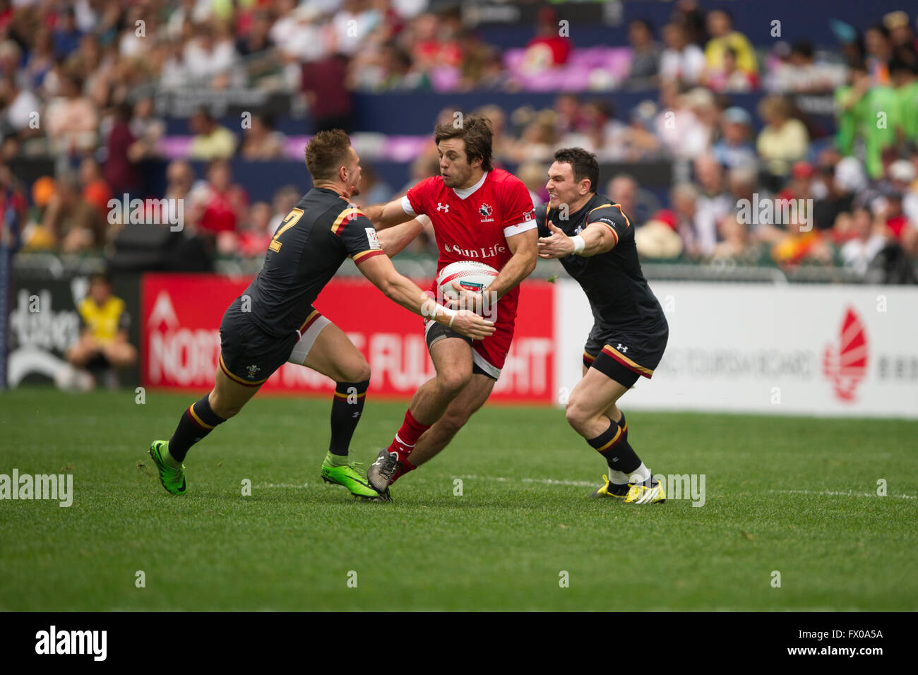 Hong Kong, China. 9, April, 2016. HSBC World Rugby Sevens Series-round 7, Hong Kong Stadium. Wales vs Canada (red). Wales wins 24-10. Credit:  Gerry Rousseau/Alamy Live News Stock Photo