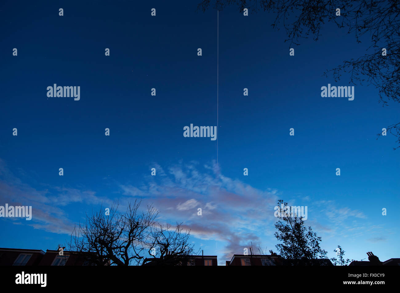 Wimbledon, London, UK. 9th April, 2016. The International Space Station tracks across the sky above London from W to E at 8:40pm at a speed of approx. 17,000mph, shining brightly in late evening skies from reflected sunlight before entering Earth’s shadow. Credit: Malcolm Park/Alamy Live News. Stock Photo