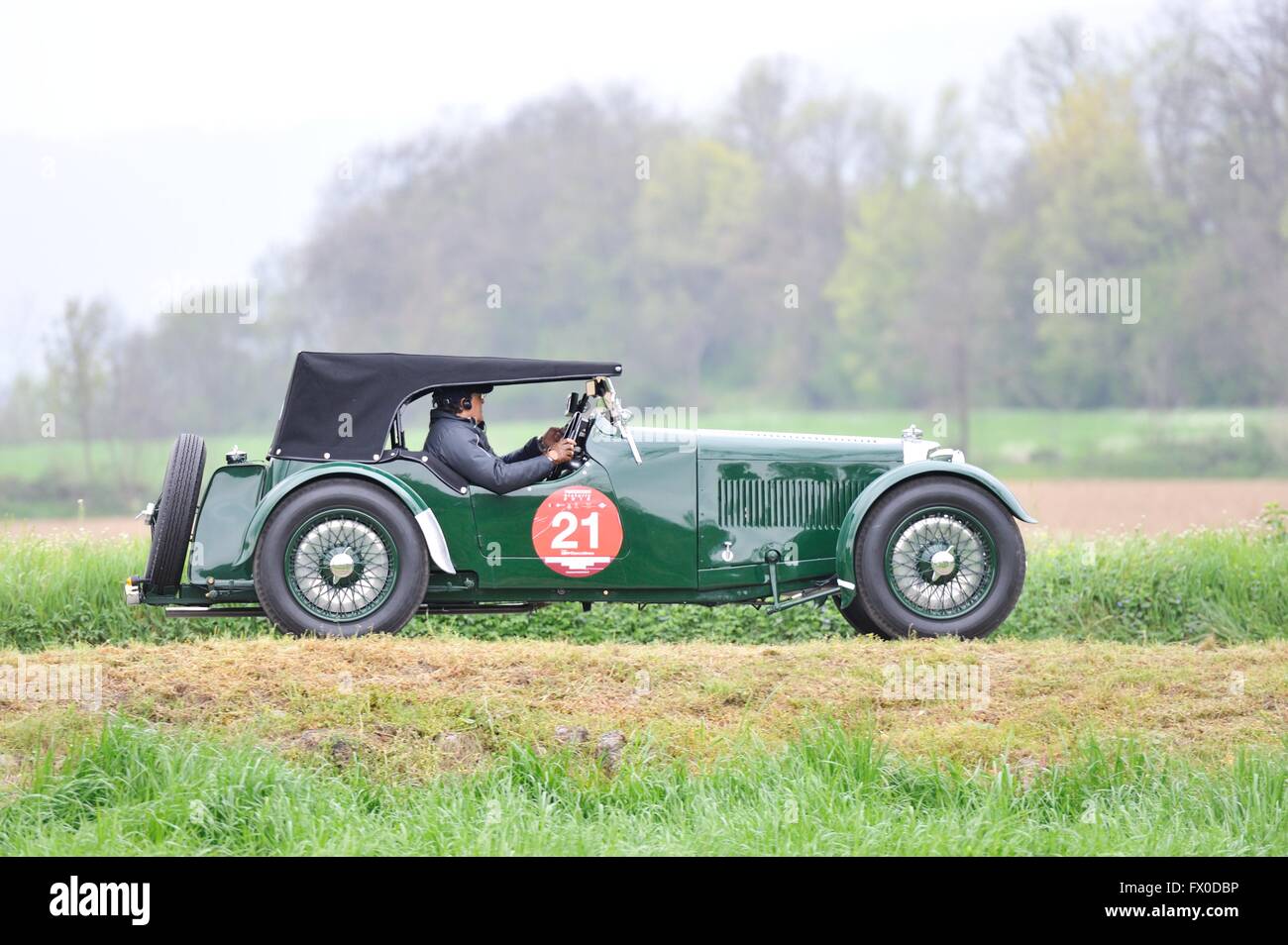 Cazzago San Martino (BS), Italy. 09th April, 2016. A green Aston Martin Le Mans, built in 1933, takes part to the Franciacorta Historic classic car race. Roberto Cerruti/Alamy Live News Stock Photo