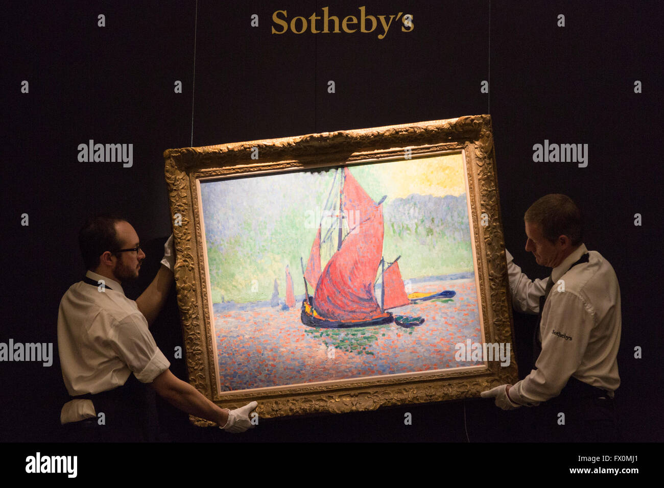 London, UK. 8 April 2016. Sotheby's employees handling the painting Les Voiles Rouges, 1906, by Andre Derain. Estimate USD 15-20 million. Sotheby's Auction Preview of Impressionist & Modern Art Evening Sale in London. The sale takes place in New York on 9 May 2016. Stock Photo
