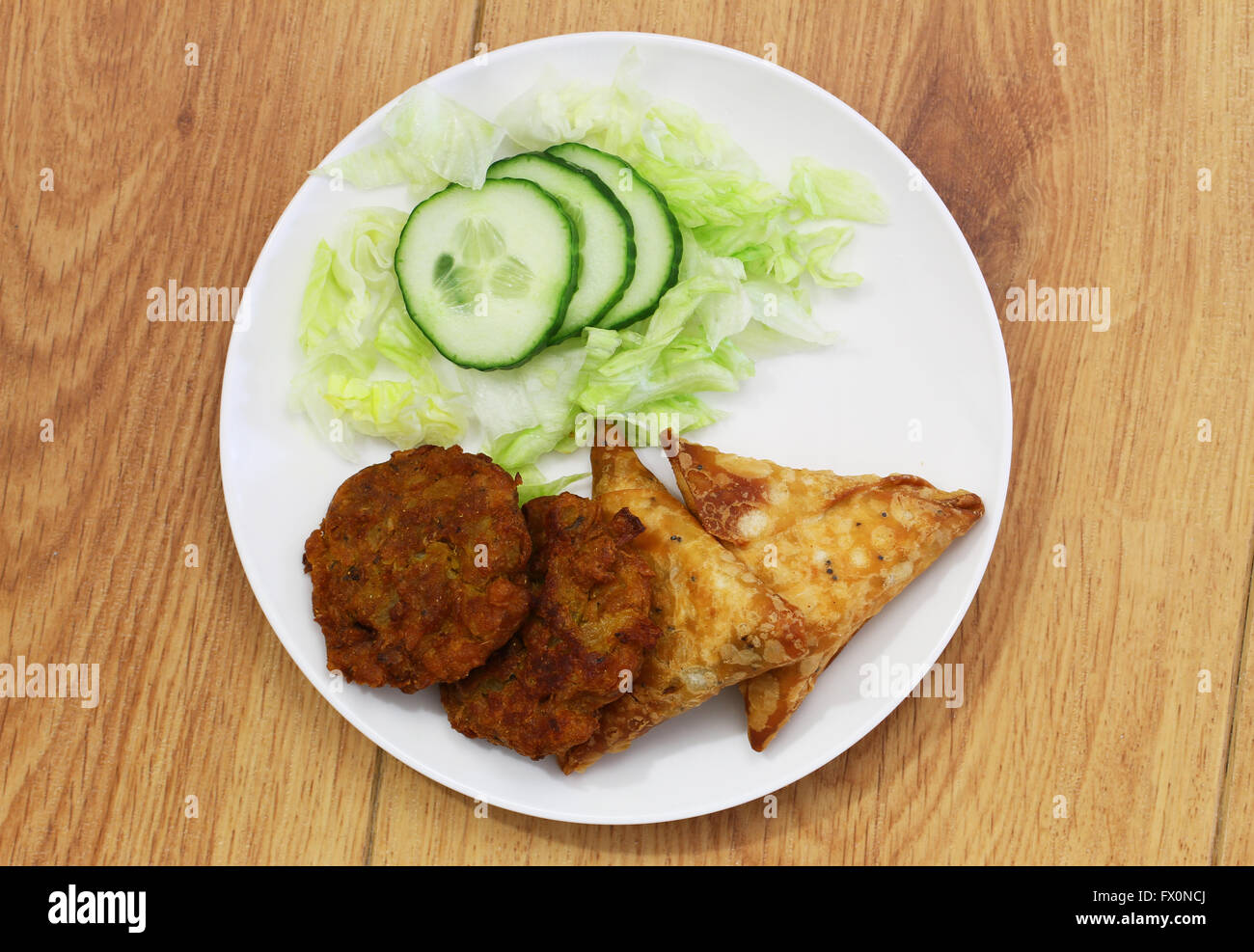 Indian samosas and pakoras with side salad Stock Photo