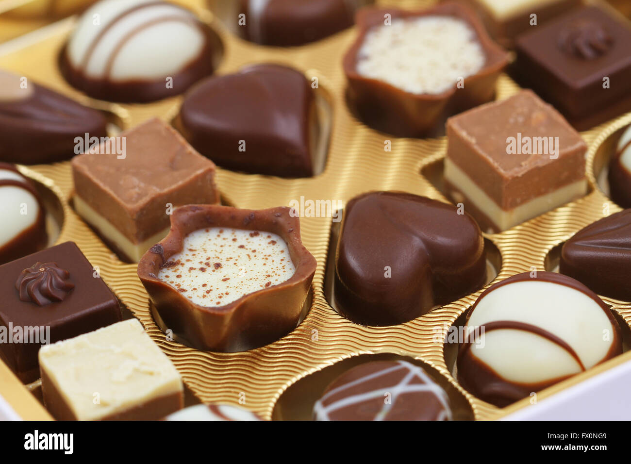 Assorted milky, white and pure chocolates, closeup Stock Photo