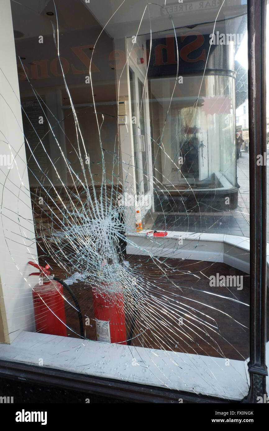 Broken glass in shop window. Stock Photo