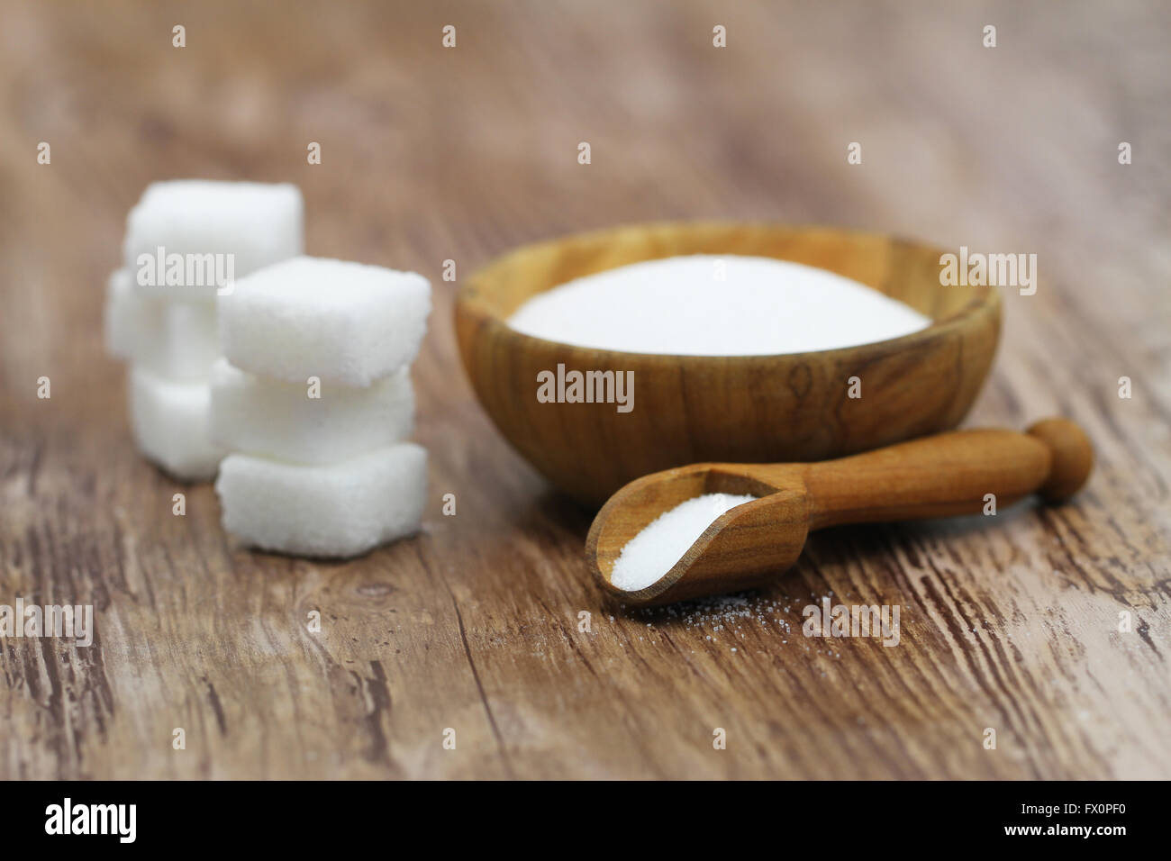 Sugar cubes and salt in wooden bowl Stock Photo - Alamy